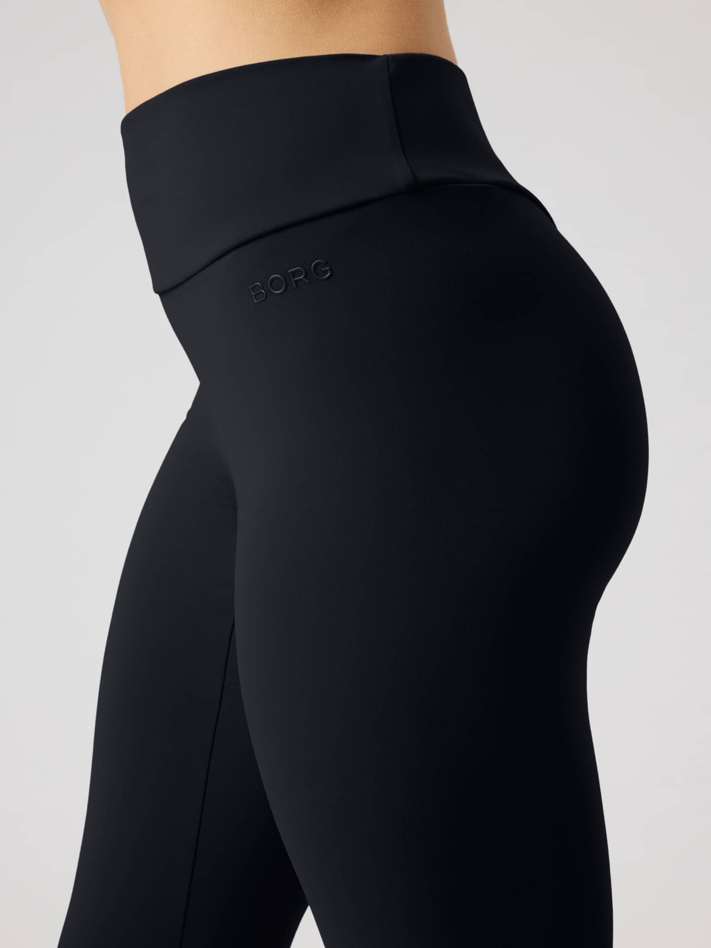 Side close-up of Studio Soft Tights in Black Beauty (Black) showing the high waist and tonal Borg logo for training. - Image 4