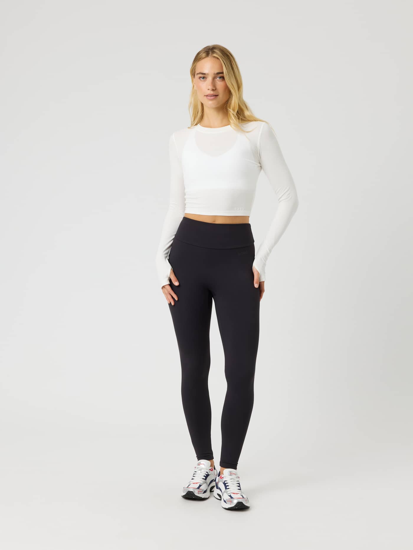Full-body front view of a model wearing Studio Soft Tights in Black Beauty (Black) for comfortable high-waist training. - Image 3