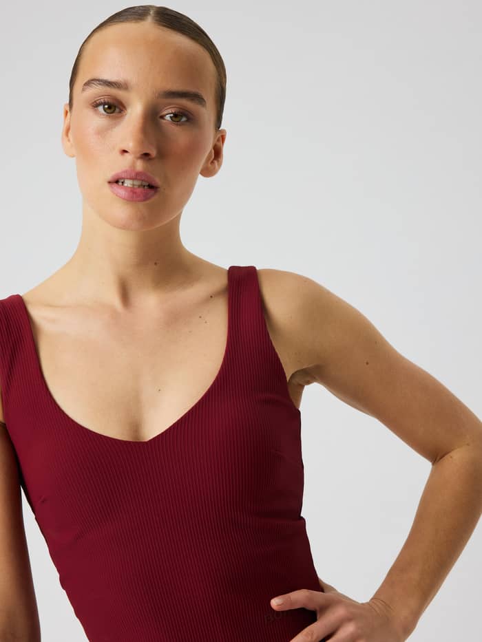 Close-up of the Björn Borg Studio Ribbed V-Neck Top in Cabernet (Red) highlighting the V-neck and ribbed texture.