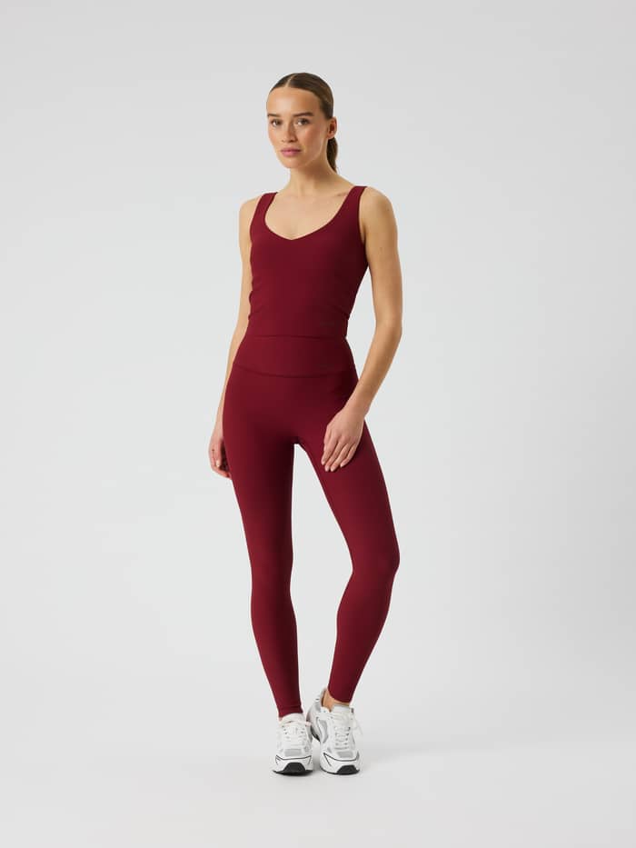Studio Ribbed V-Neck Top in Cabernet (Red) featuring a V-neck front and ribbed fabric.
