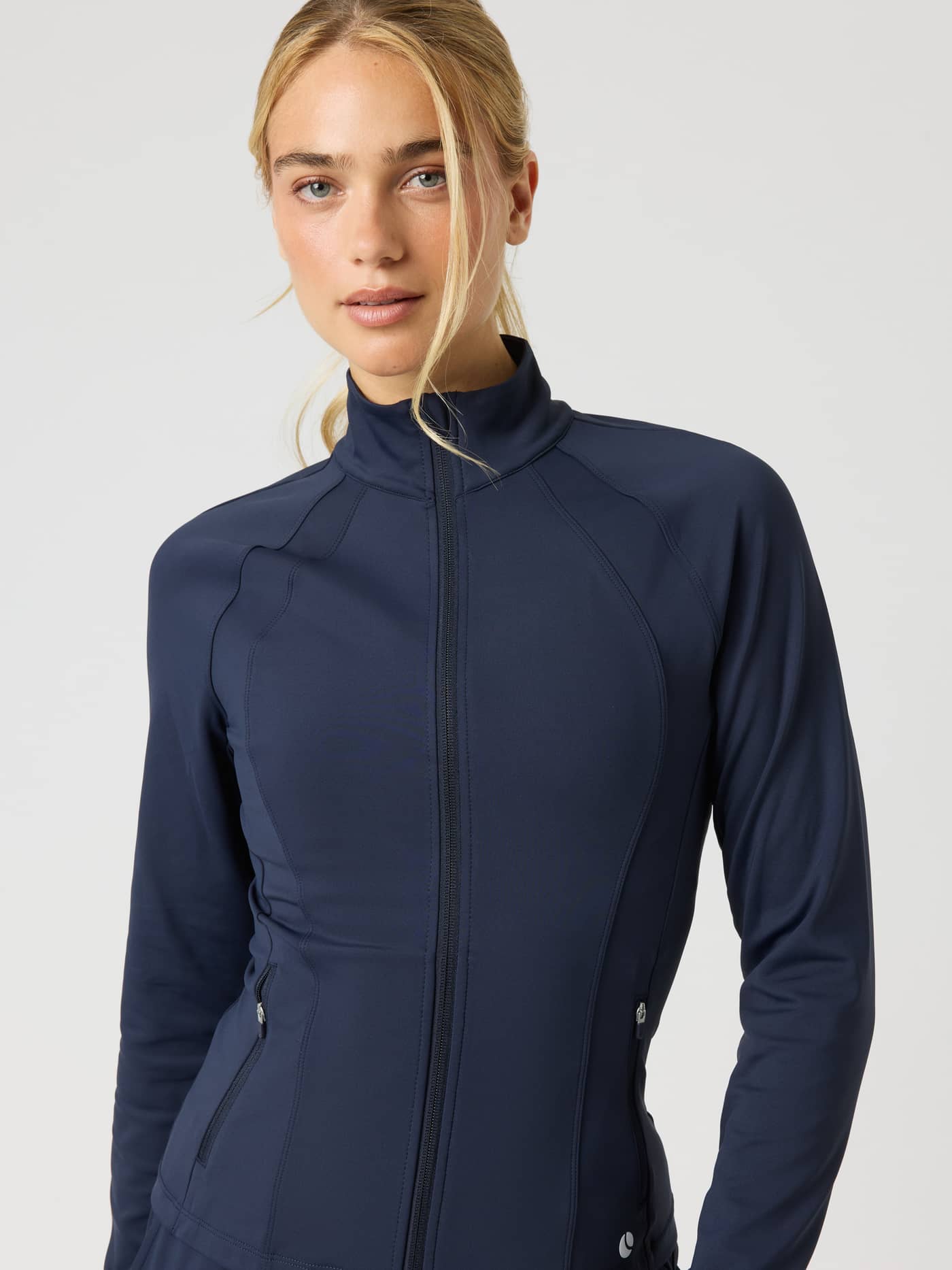 Front view of a model wearing the Ace Track Jacket in Night sky (Navy) for a technical tennis and training fit. - Image 5