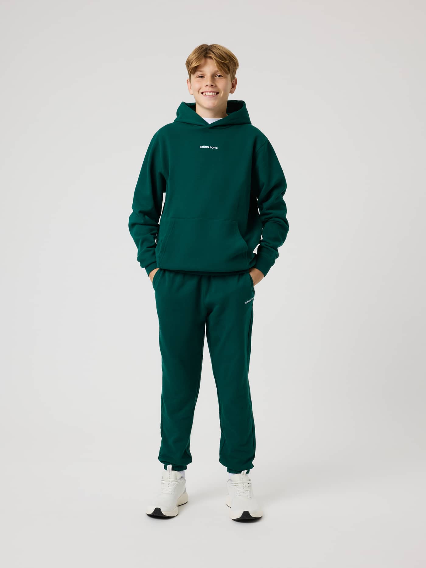 Full-body front view of the kids' Borg Classic Hoodie in Rain Forest (Green) featuring a white logo and kangaroo pocket. - Image 3