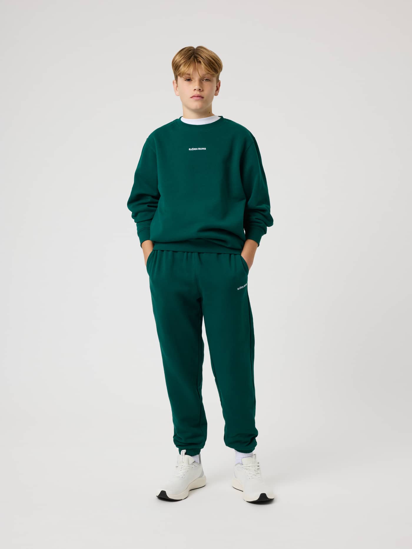 Borg Classic Sweatpants for kids in Rain Forest (Green) featuring a white logo and a relaxed, comfortable fit. - Image 3