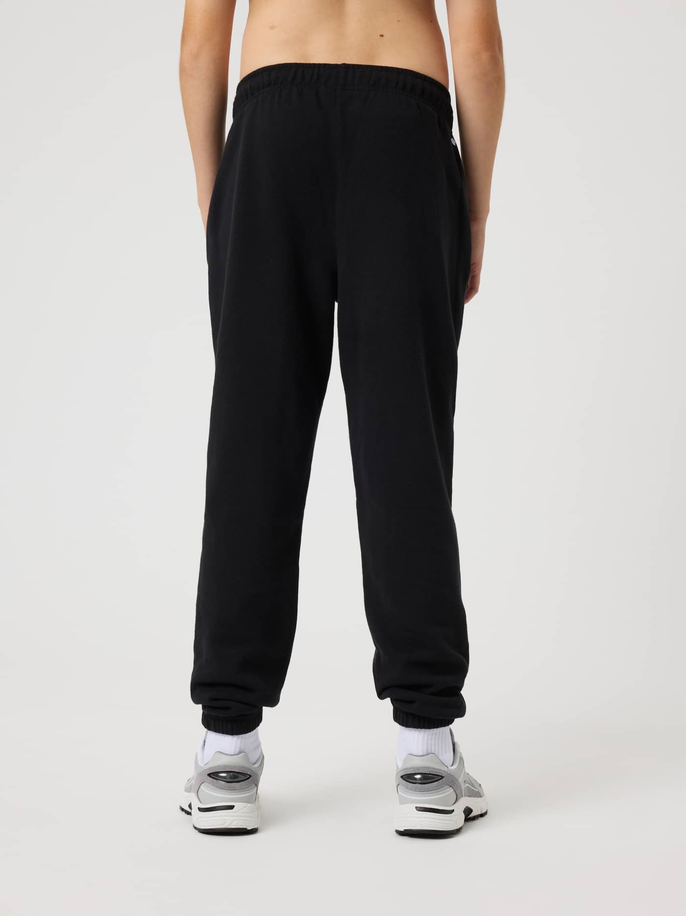 Back view of kids wearing Borg Classic Sweatpants in Black Beauty (Black), with a relaxed fit and ribbed cuffs. - Image 2