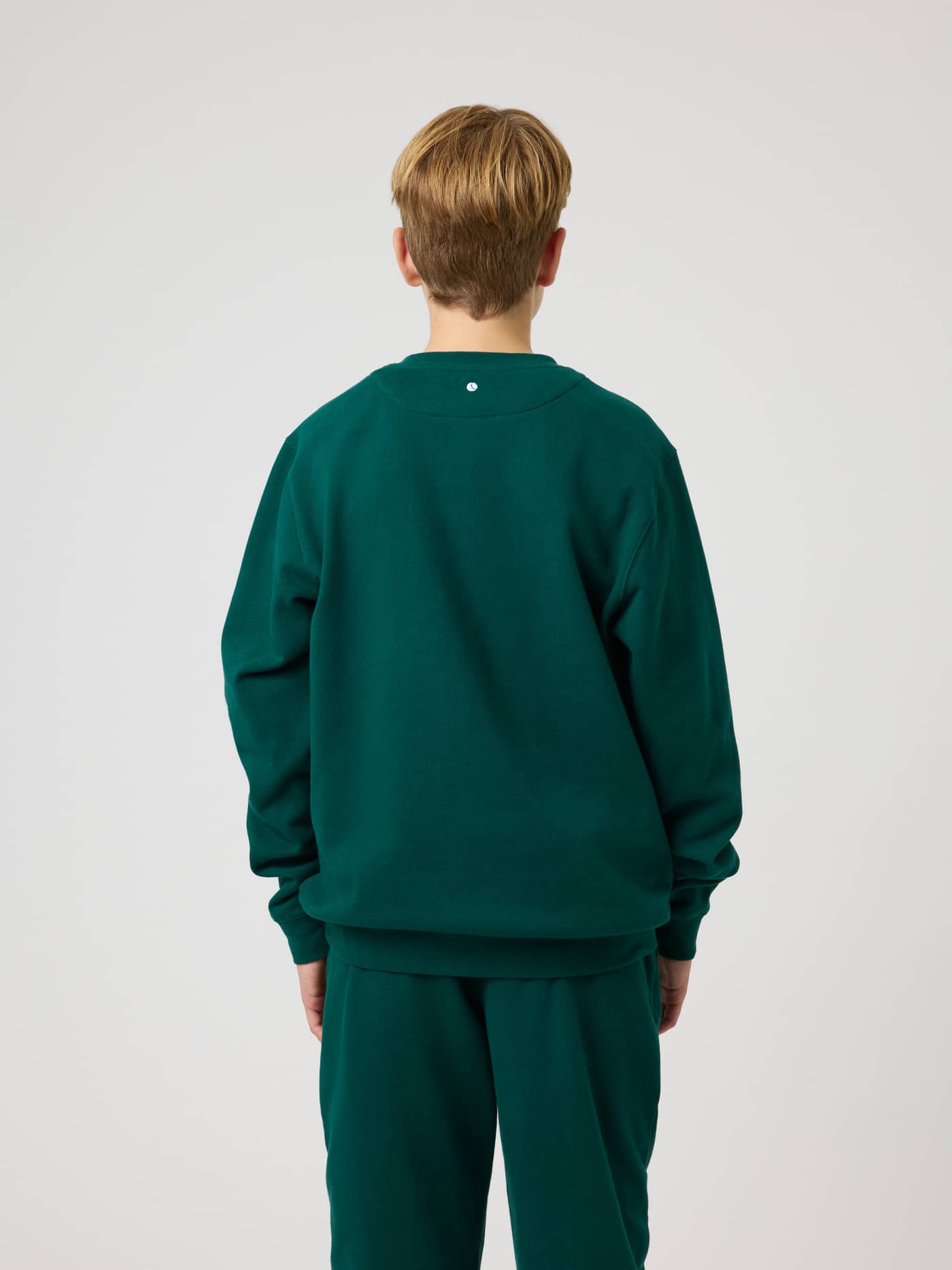 Back view of the kids Borg Classic Sweatshirt in Rain Forest (Green) with a tennis ball print at the back neck. - Image 2