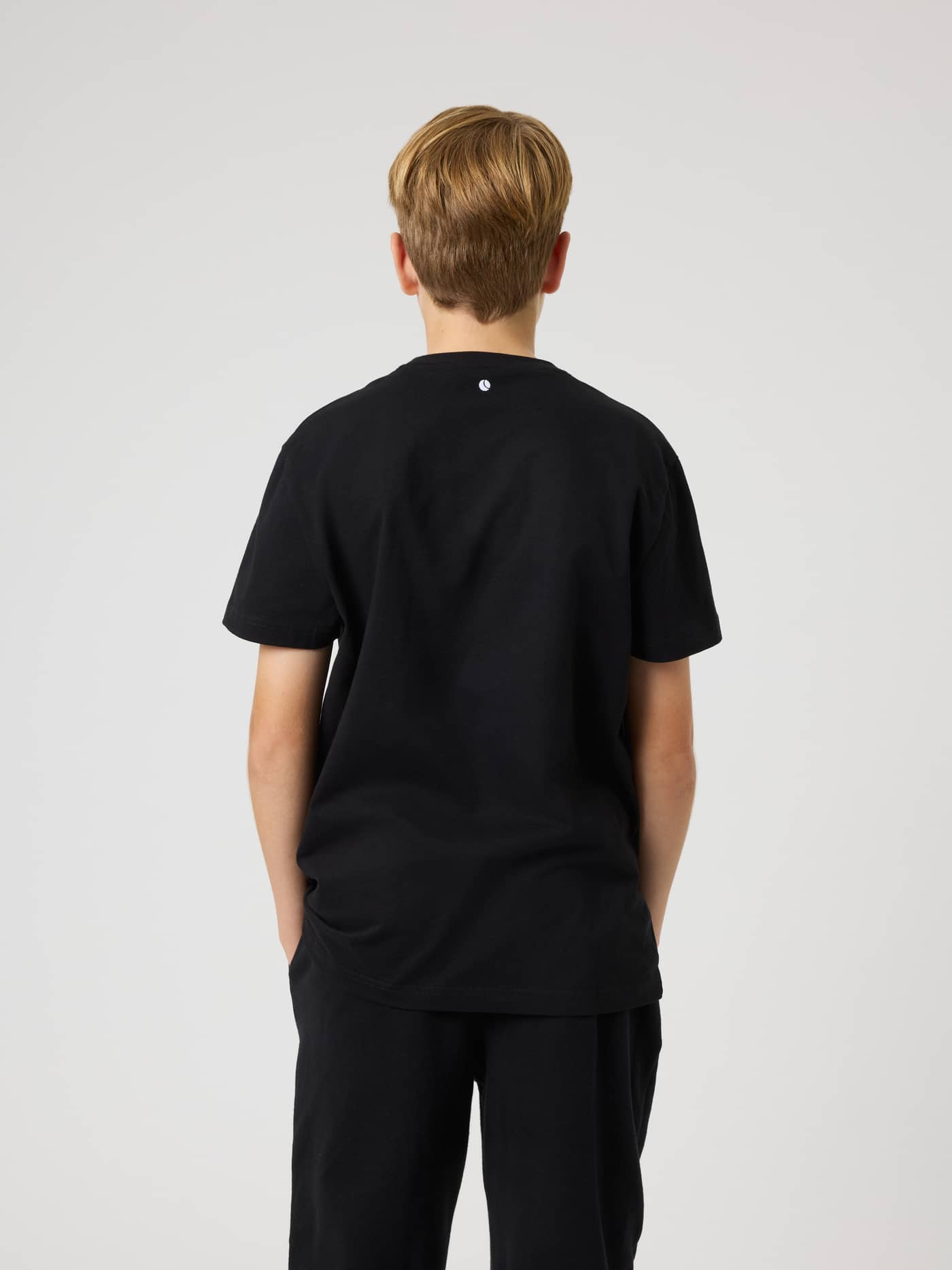 Back view of the kids' Borg Classic T-Shirt in Black Beauty (Black) featuring a small white tennis ball print. - Image 2