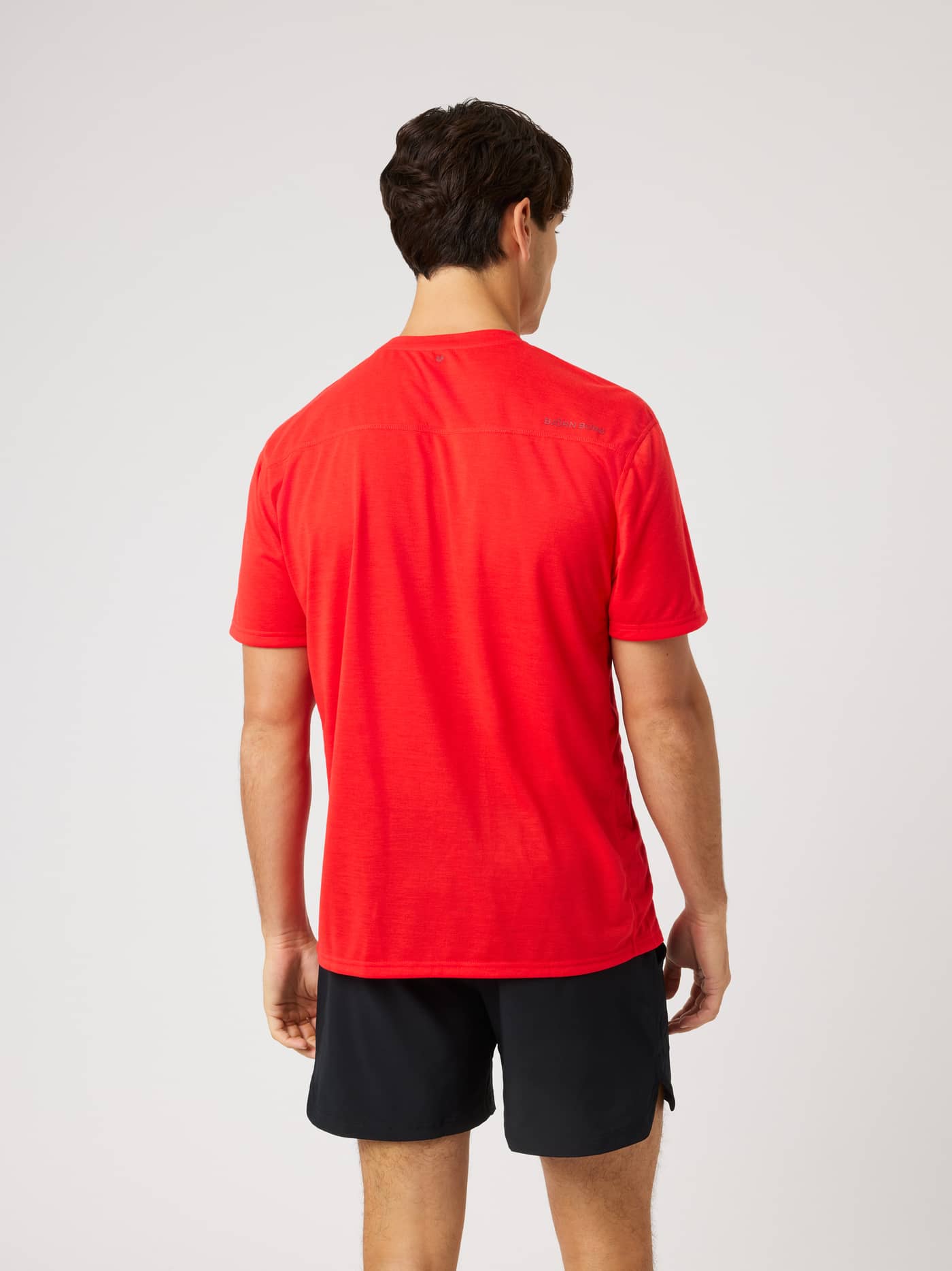 Back view of the Borg Soft Sports T-Shirt in Flame Scarlet (Red), a quick-drying training and tennis top with a red logo. - Image 2
