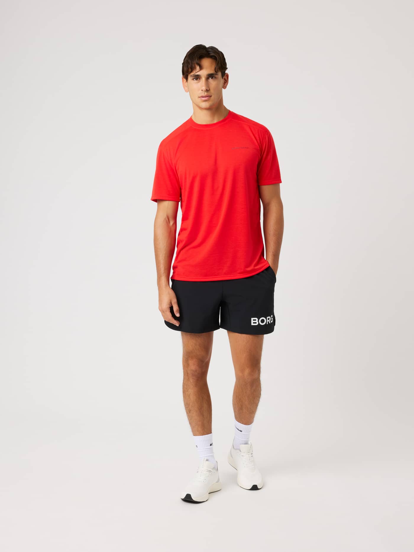 Full-body front view of a man wearing the Borg Soft Sports T-Shirt in Flame Scarlet (Red) for performance training. - Image 3