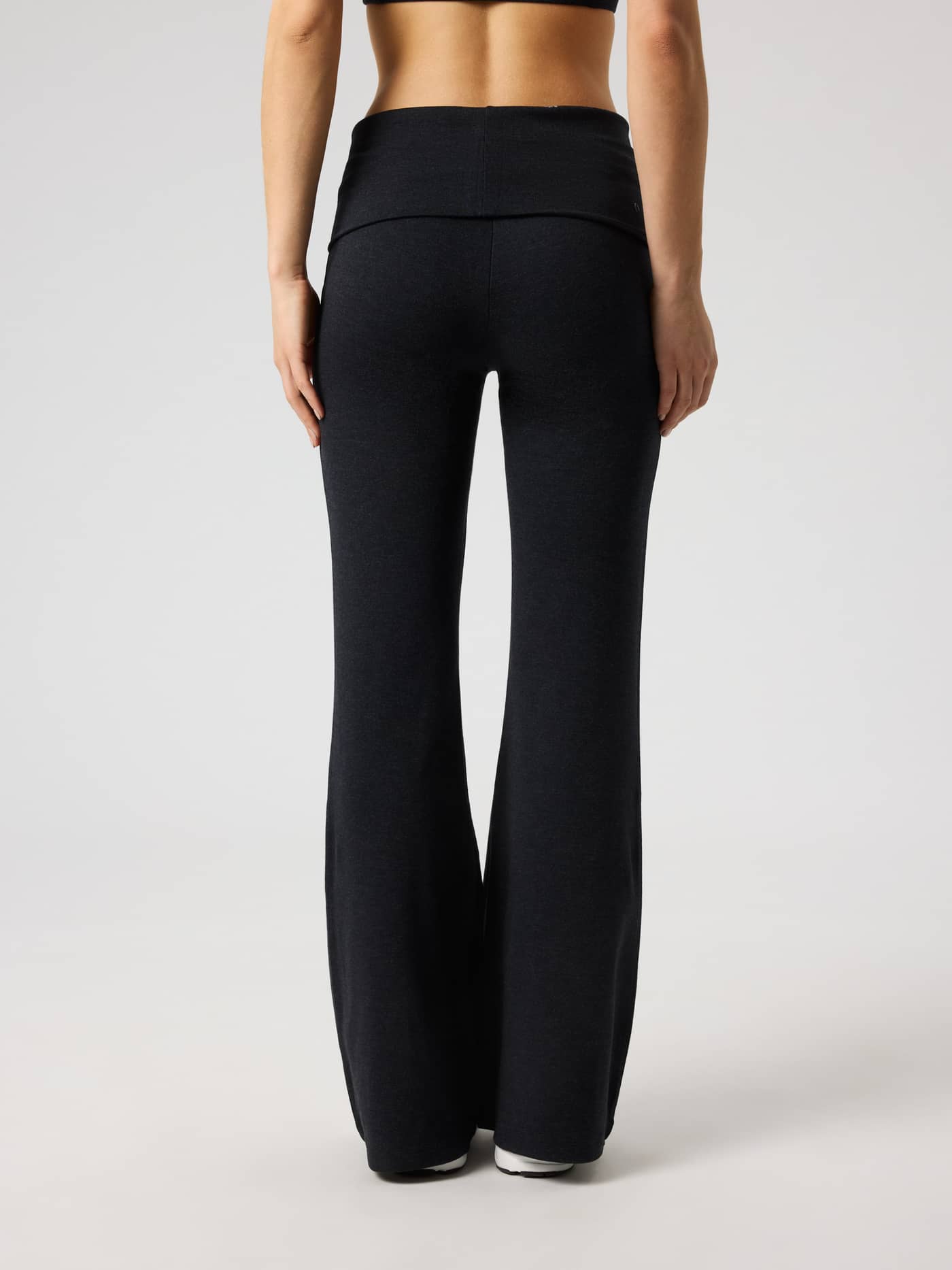 Back view of Björn Borg Studio Flow Folded Flare Tights in Black Beauty (Black) with a foldable waistband for training. - Image 3