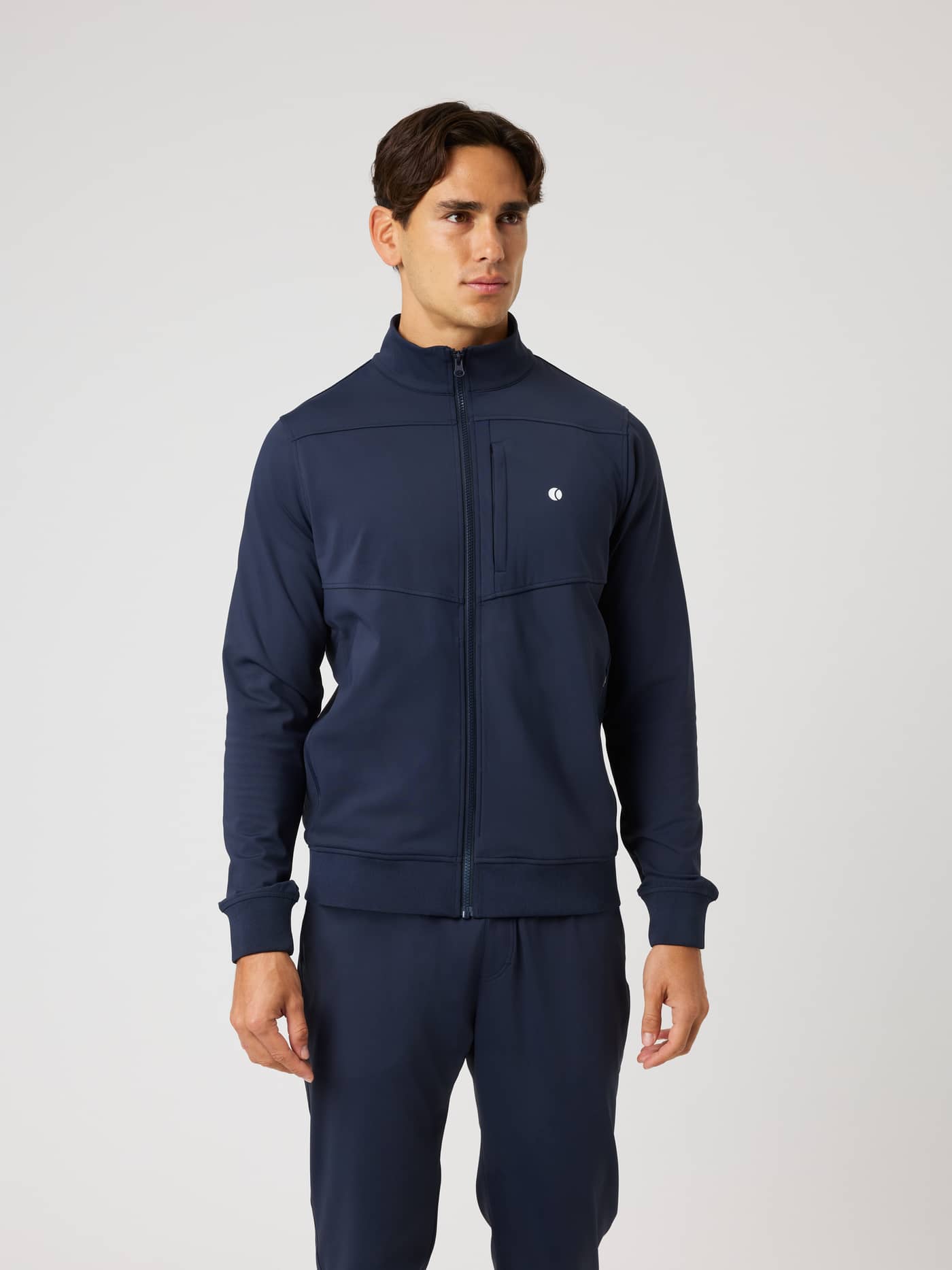 Front view of a man wearing the Björn Borg Ace Court Jacket in Night sky (Navy), a performance tennis jacket. - Image 1
