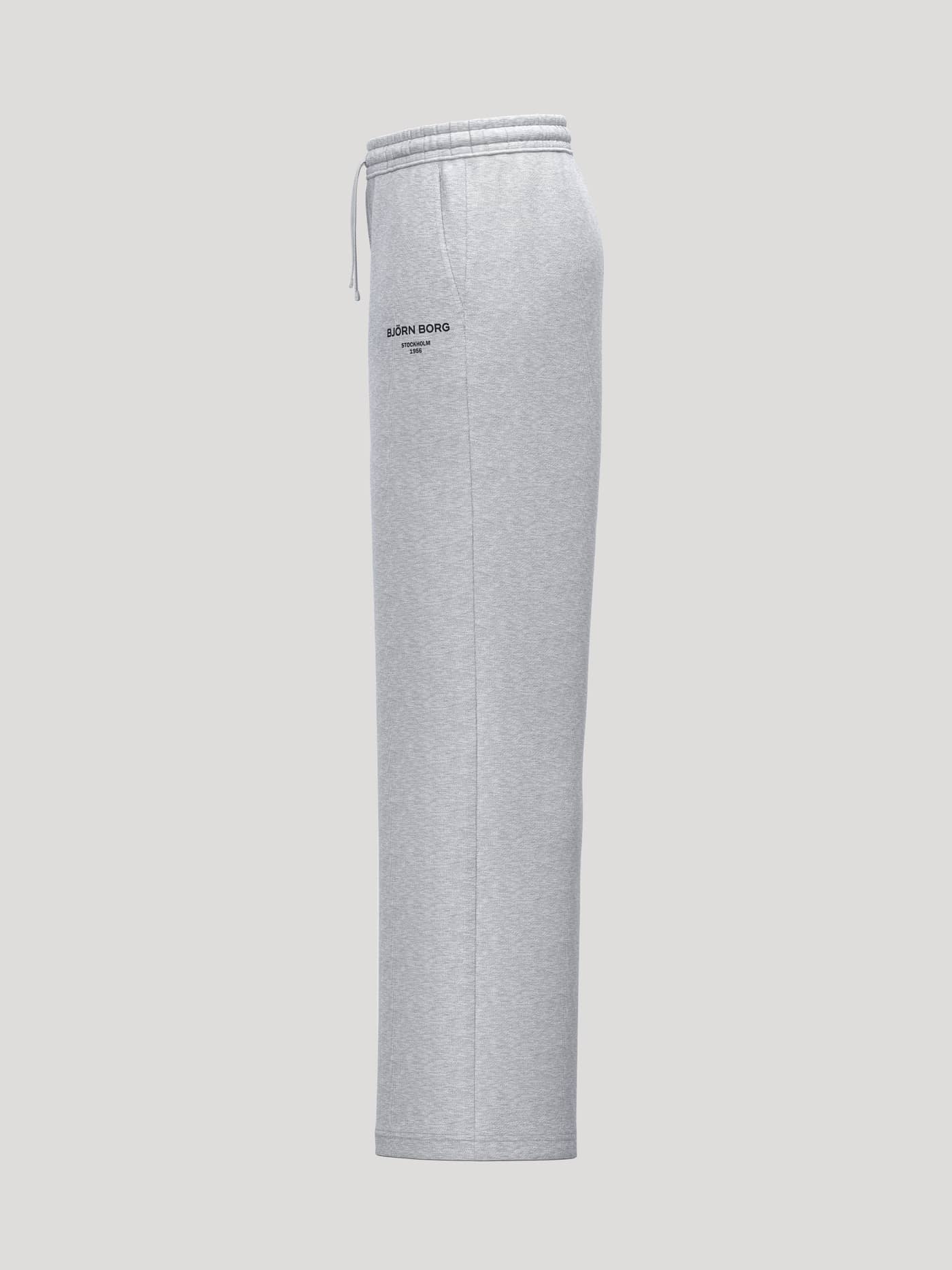 Side view of Borg Essential 1 Straight Sweatpants in Light Grey Melange (Grey) featuring a black logo graphic. - Image 3