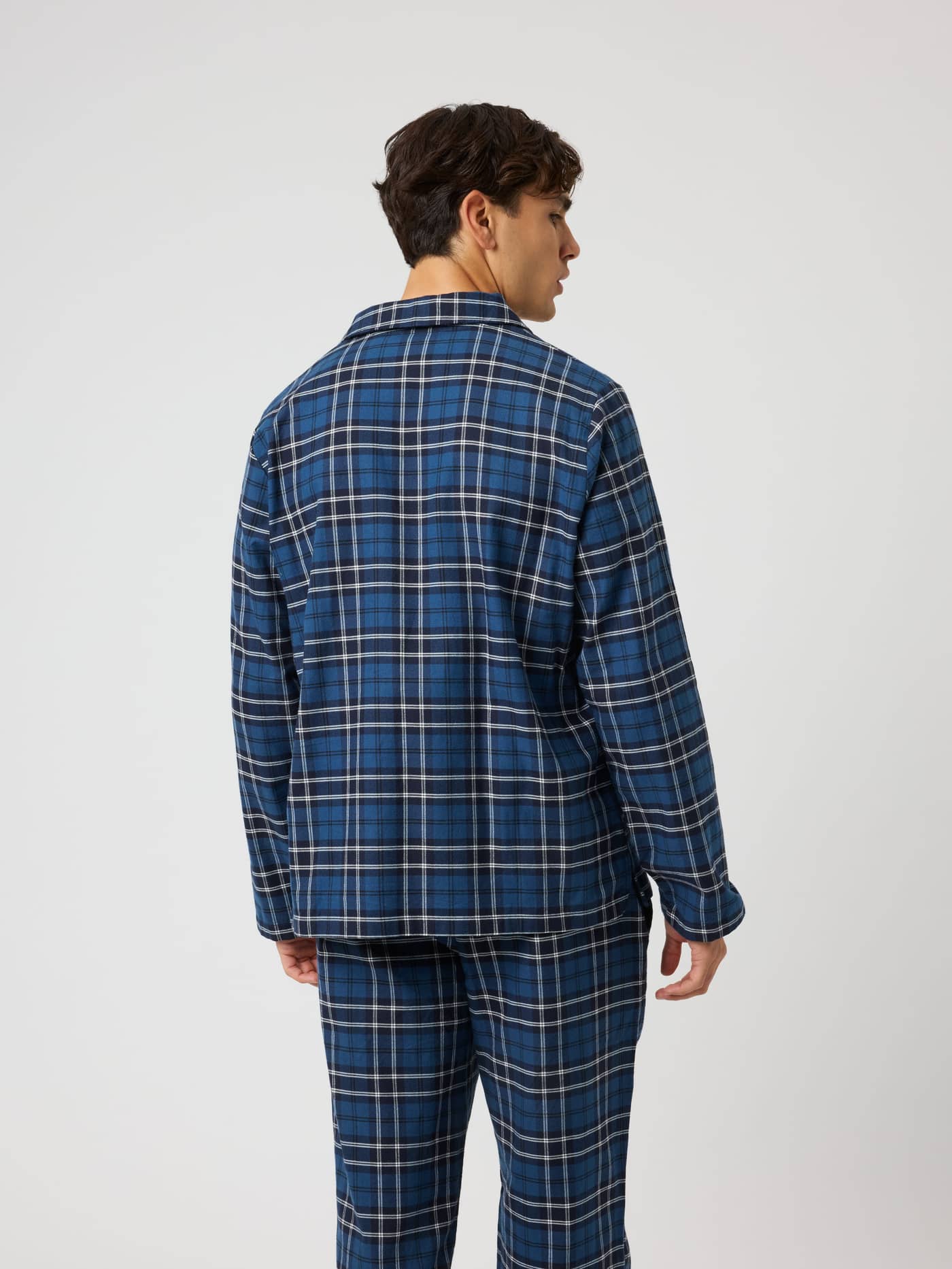 Back view of a model wearing the Björn Borg Core Flannel Pyjama Shirt in Forest Tartan 4 (Blue, Navy) with a check pattern. - Image 2