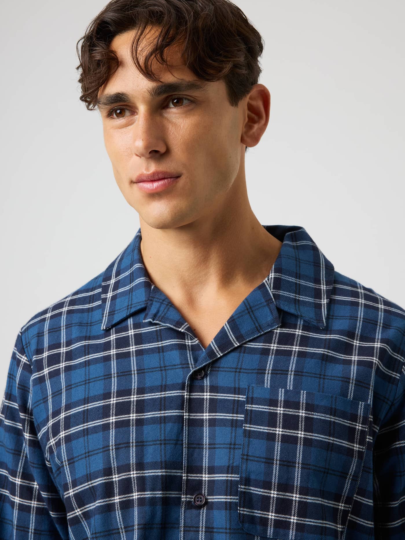 Close-up of the Core Flannel Pyjama Shirt in Forest Tartan 4 (Blue) with a soft brushed finish and navy tartan pattern. - Image 4
