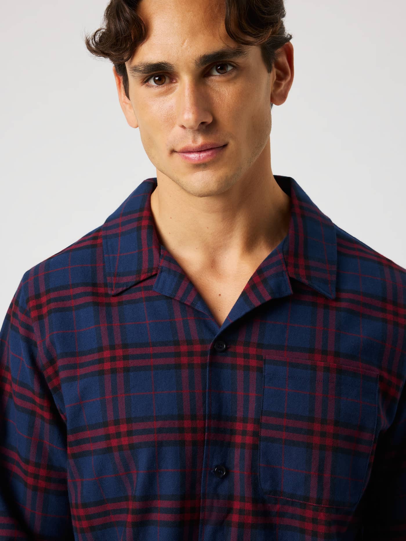 Close-up of the Core Flannel Pyjama Shirt in blue and red tartan plaid pattern featuring soft brushed cotton flannel. - Image 4