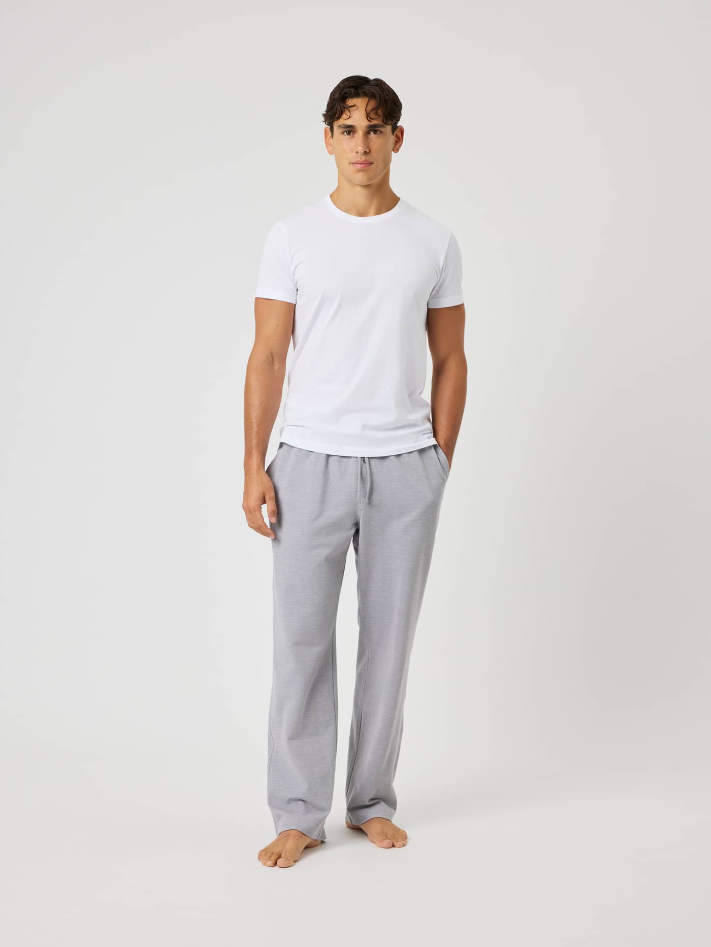 Full-body front view of a man wearing Björn Borg Core Pique Pyjama Pants in Charcoal Gray (Grey) with a relaxed fit. - Image 3