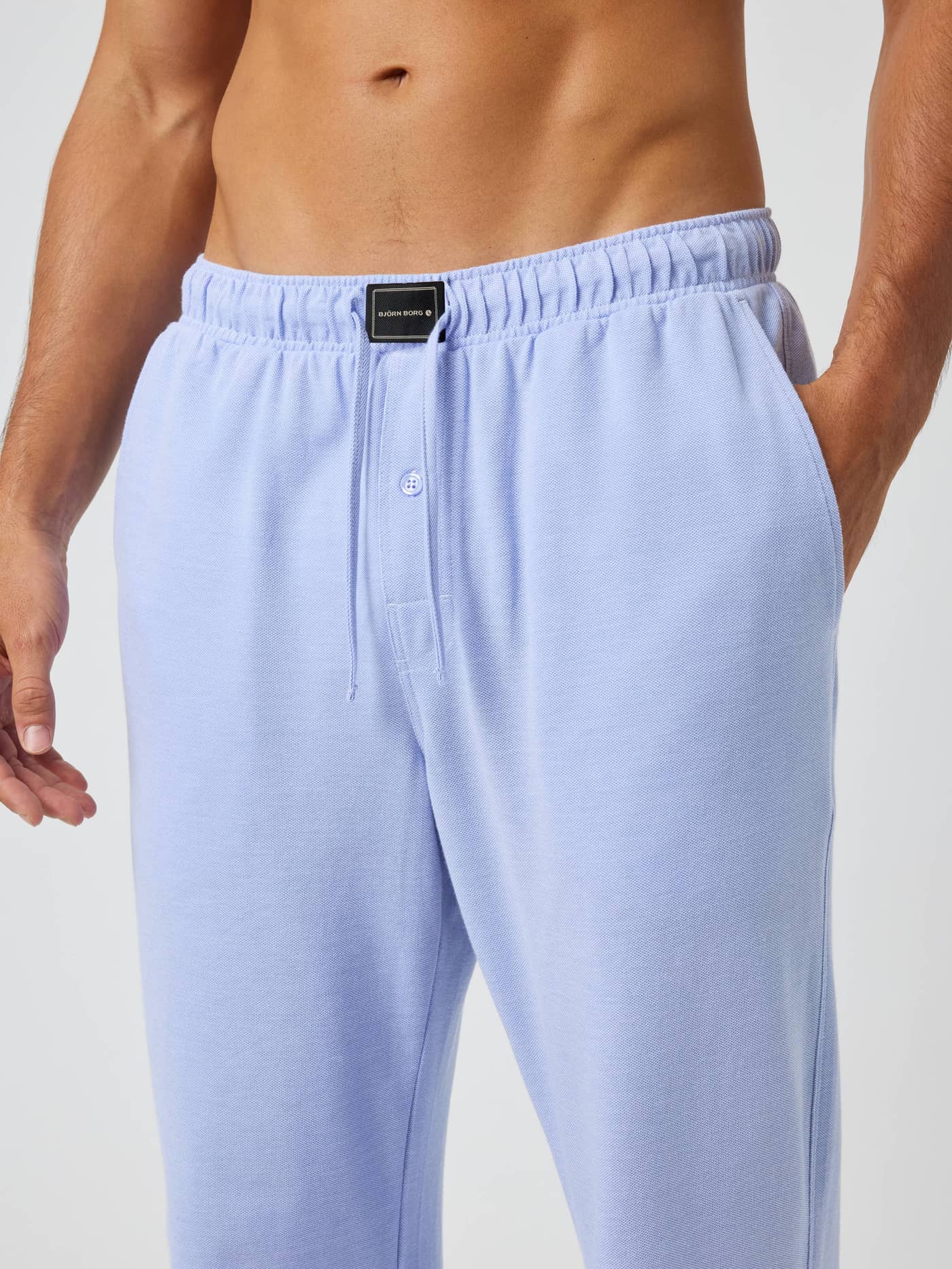 Core Pique Pyjama Pants in Lavender Lustre (Purple) featuring a black logo patch and adjustable drawstring. - Image 5