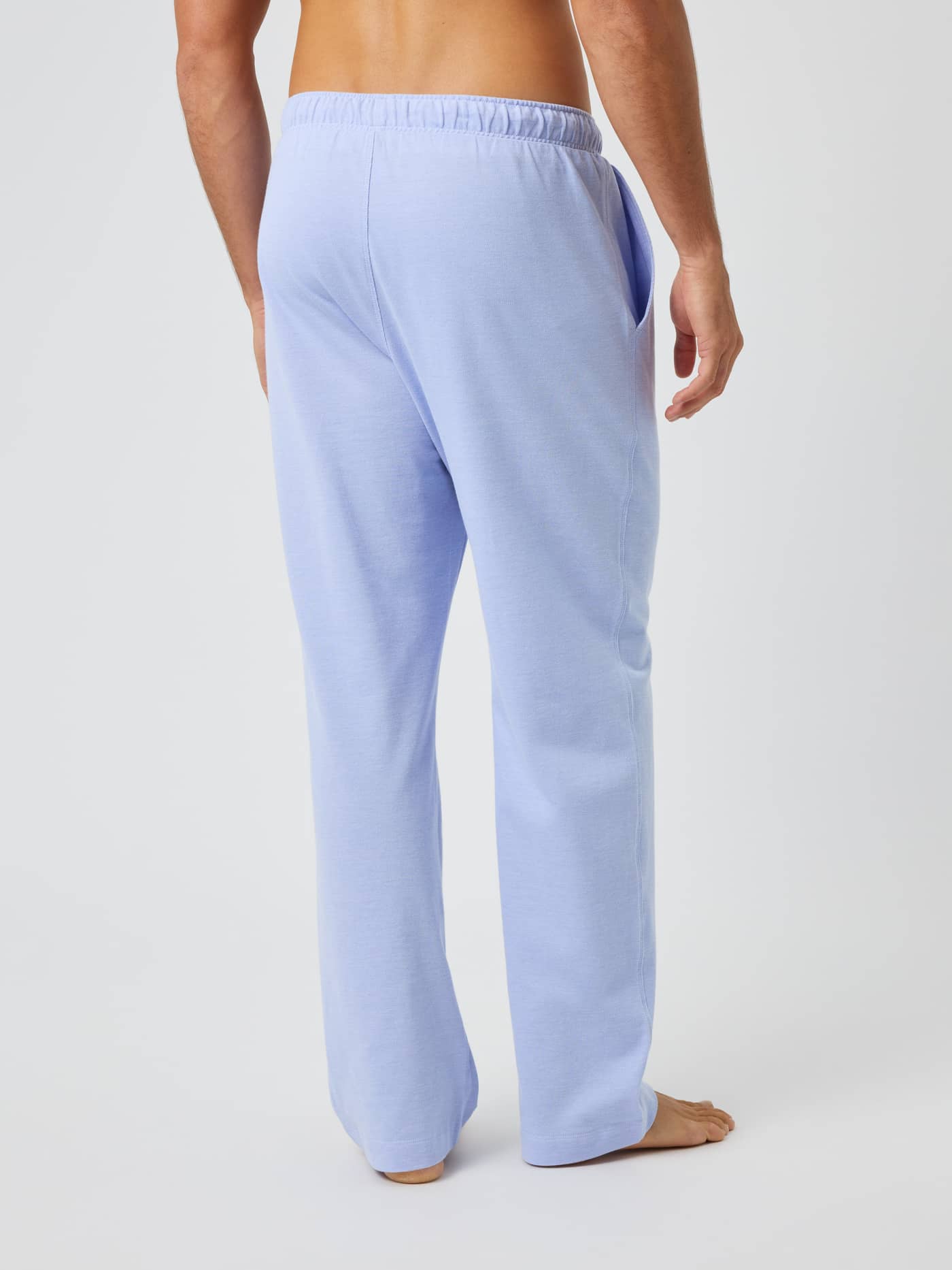 Back view of a man in Björn Borg Core Pique Pyjama Pants in Lavender Lustre (Purple) made from soft cotton pique. - Image 2