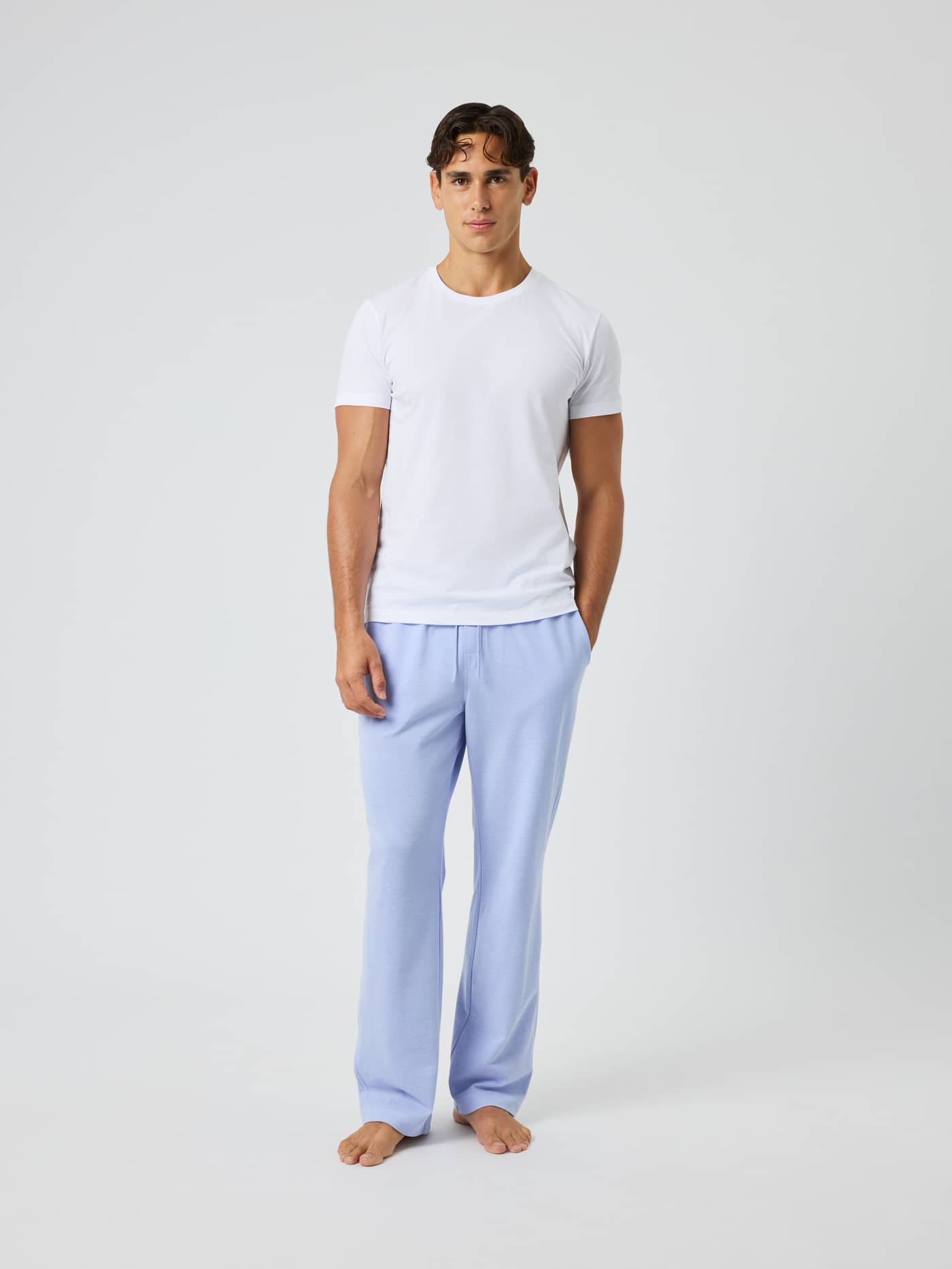 Full-body front view of a model wearing Core Pique Pyjama Pants in Lavender Lustre (Purple) with a black logo label. - Image 3