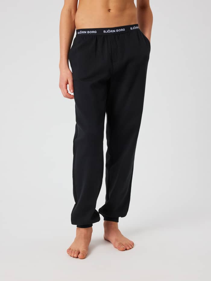 Front view of Björn Borg Core Loungewear Pants for kids in Black Beauty (Black) with a branded logo waistband.