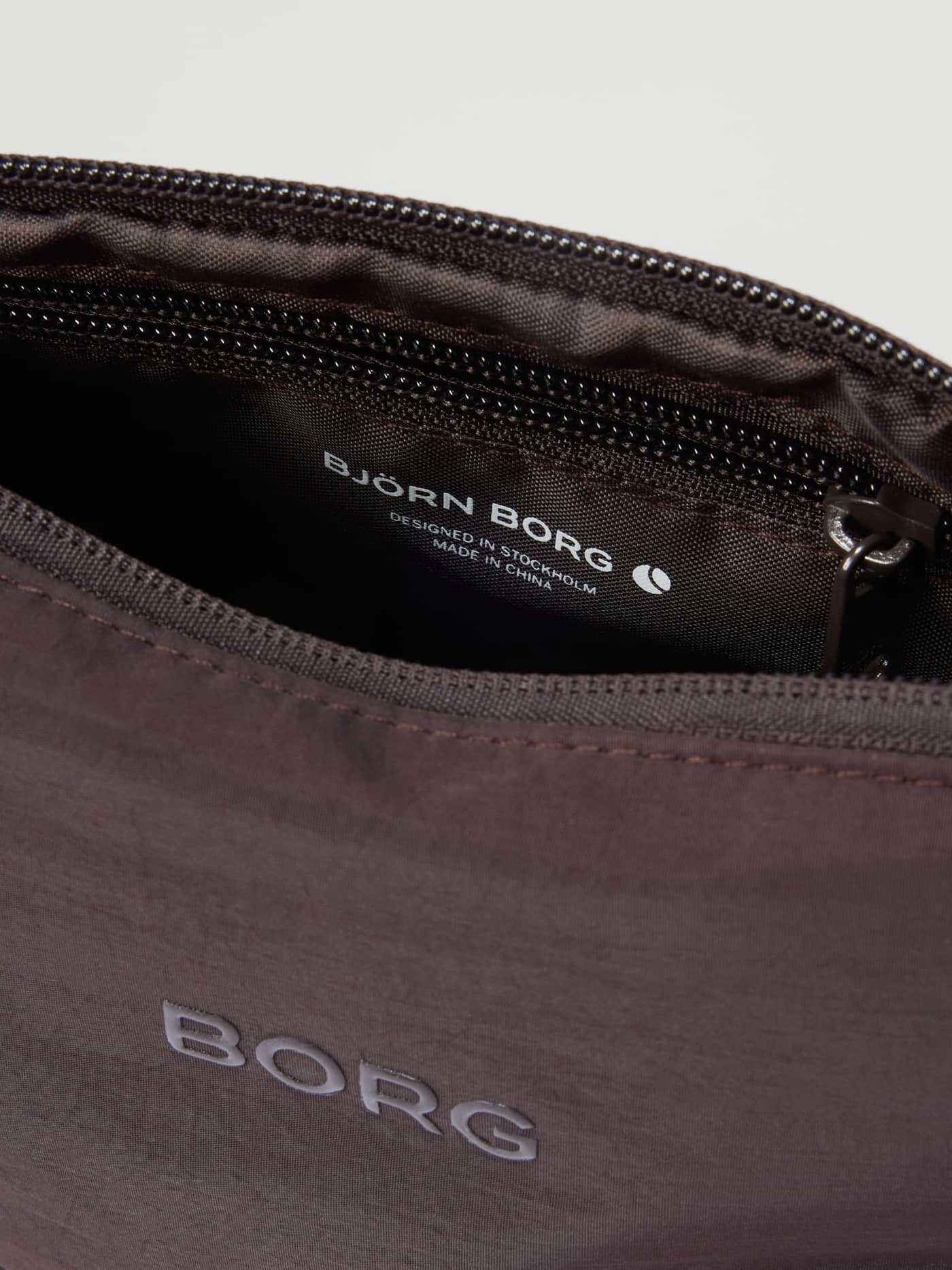 Studio Active Wash Bag Set in Coffee Bean (Brown) for training, featuring a silver BORG logo and zip closure. - Image 7