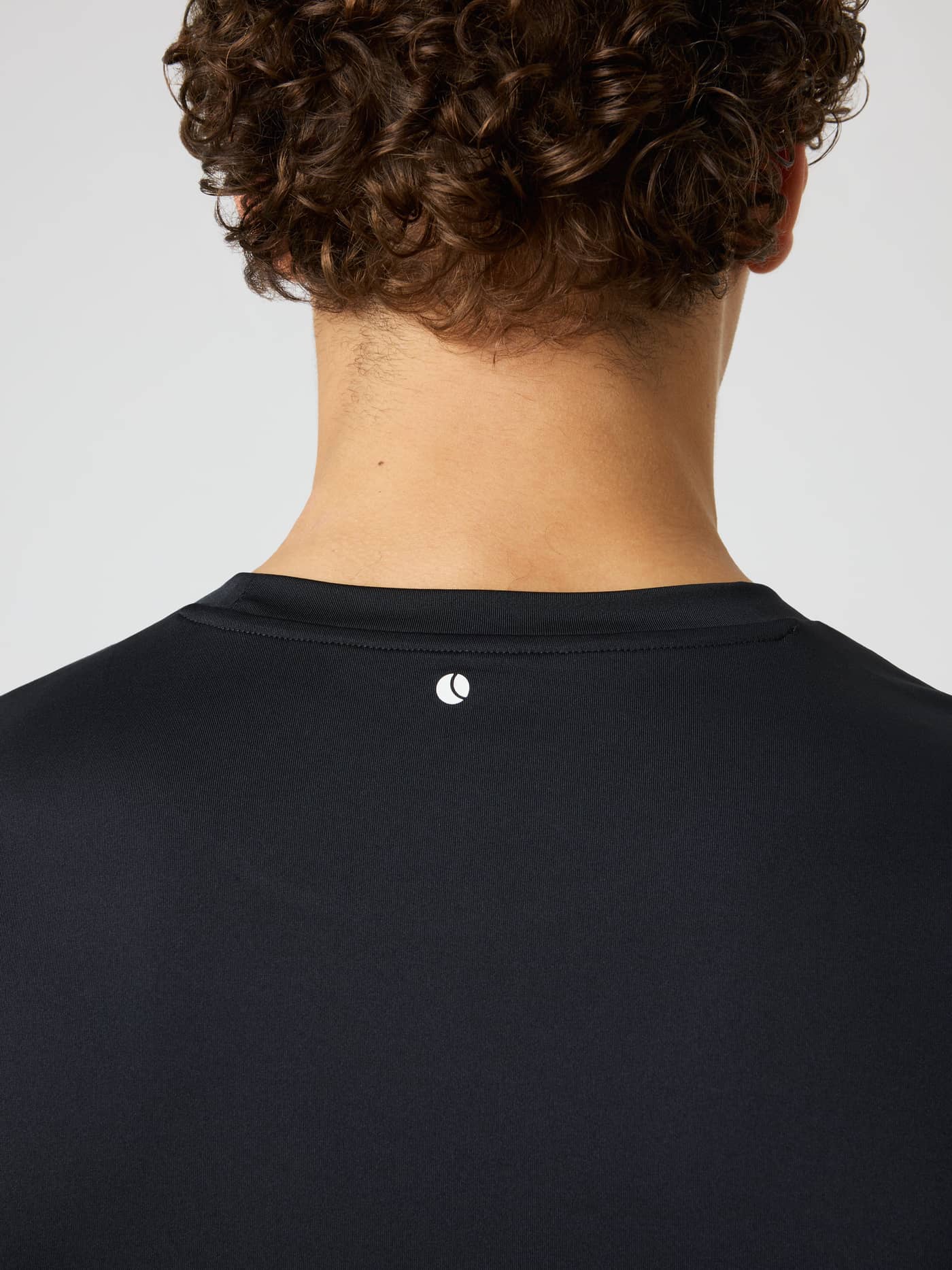 Back neck view of the Borg Graphic T-Shirt in Black Beauty (Black) with a white tennis ball print for tennis and training. - Image 5