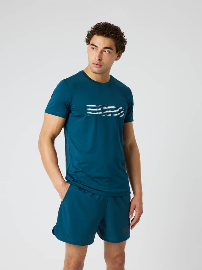 Borg Graphic T-Shirt i Reflecting Pond (Grøn) set forfra på en model med hvidt brystlogo til træning.