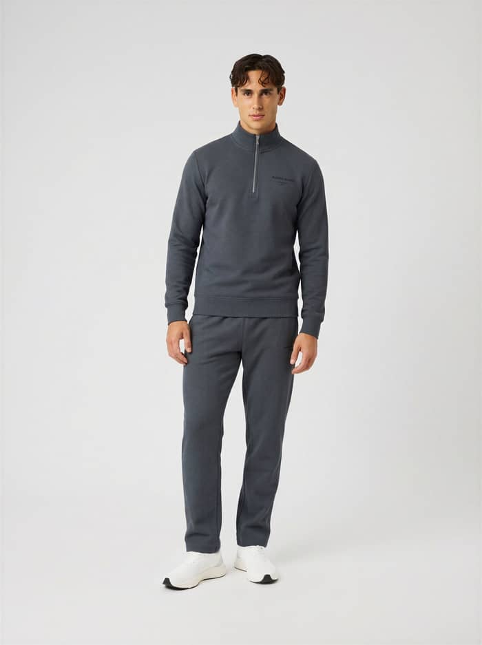 Man wearing the Borg Essential 1 Half Zip in Turbulance (Grey) for training and everyday movement.