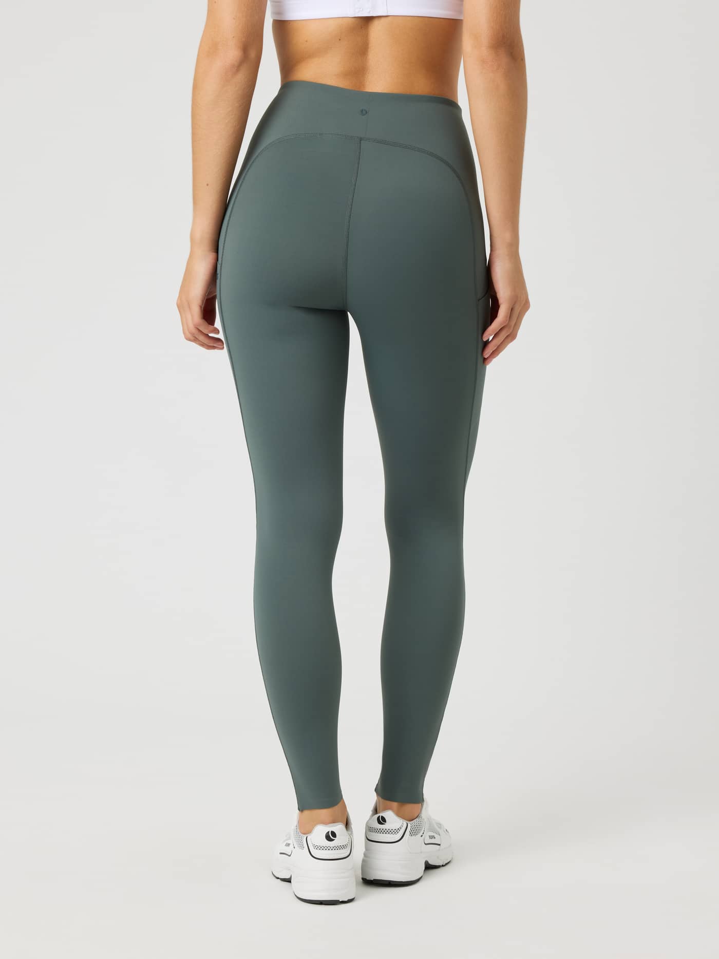 Back view of the Borg Reform Pocket Tights in Urban Chic (Green) for a functional, high-waisted training fit. - Image 2