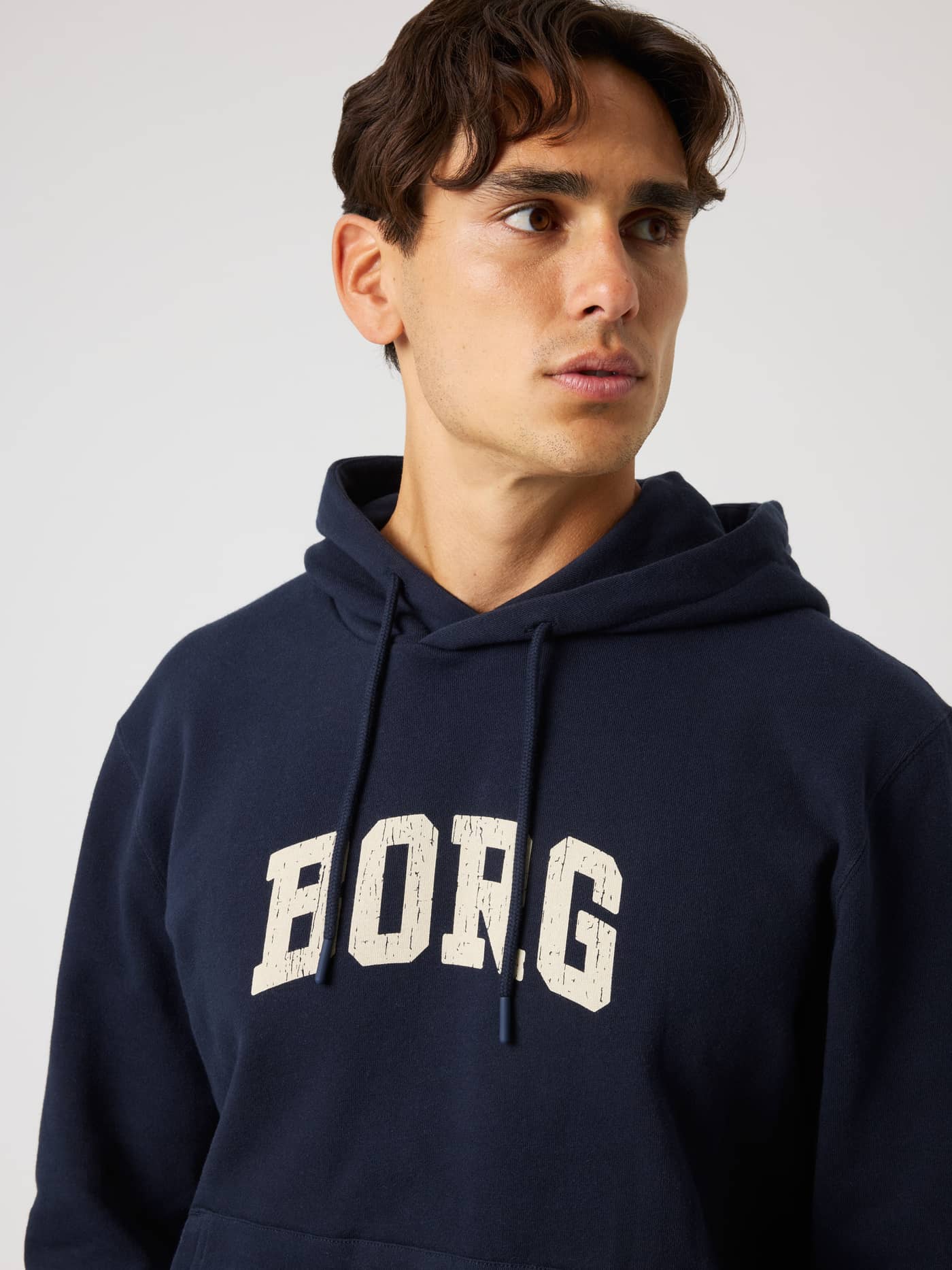 Front view of the Borg Classic Print Hoodie in Night Sky (Navy) featuring a white distressed logo for training. - Image 5
