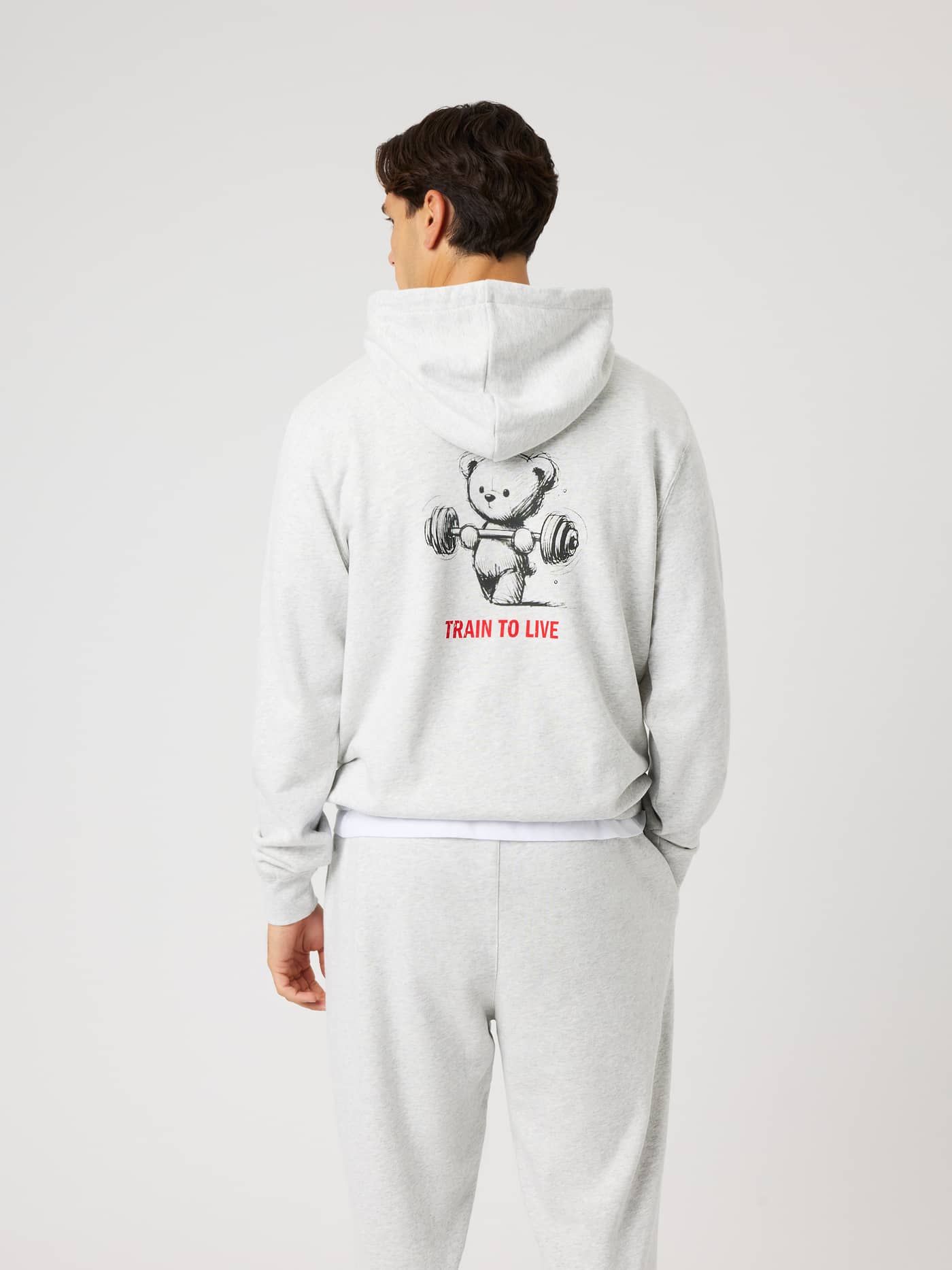 Back view of the Borg Classic Print Hoodie in Ultra Light Grey Melange (Grey) featuring a bear training graphic. - Image 2
