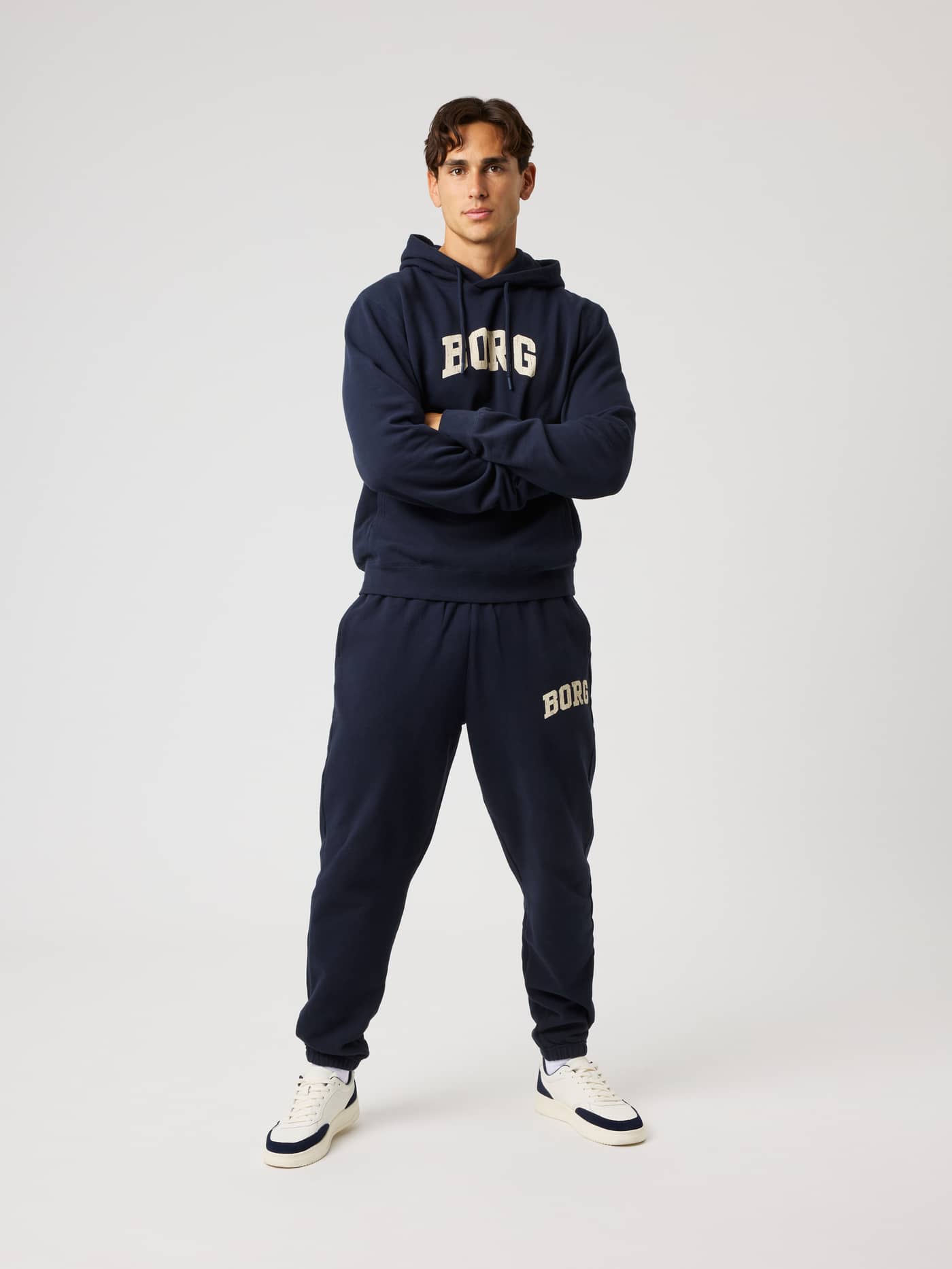 Full-body front view of a model in the cotton Borg Classic Print Hoodie in Night Sky (Navy) for training and recovery. - Image 4
