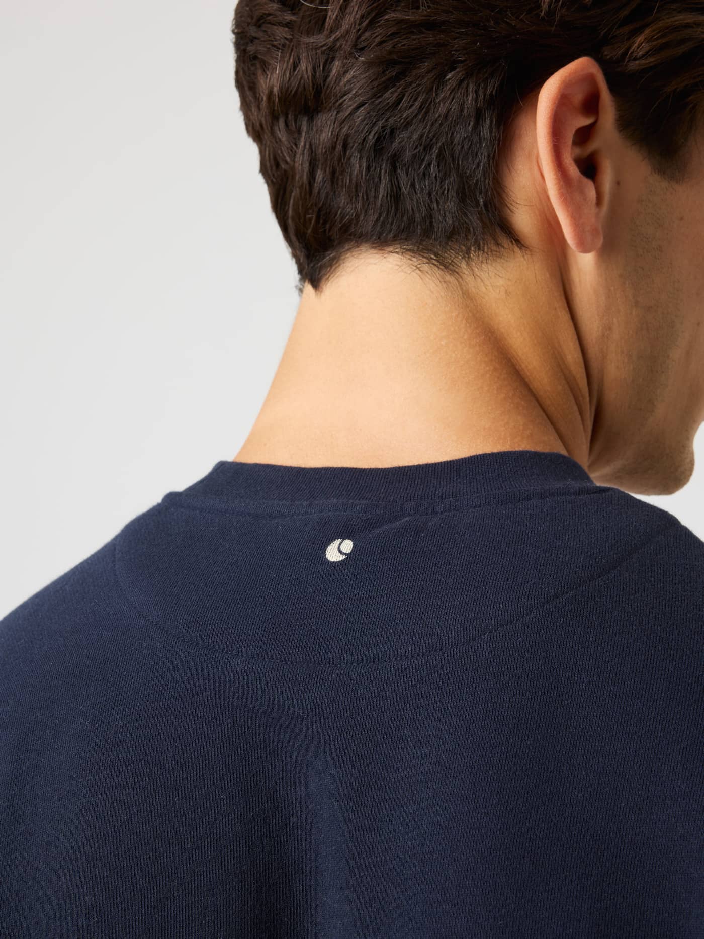 Close-up back neck view of the Borg Classic Print Sweatshirt in Night Sky (Navy) featuring a tennis ball print. - Image 4