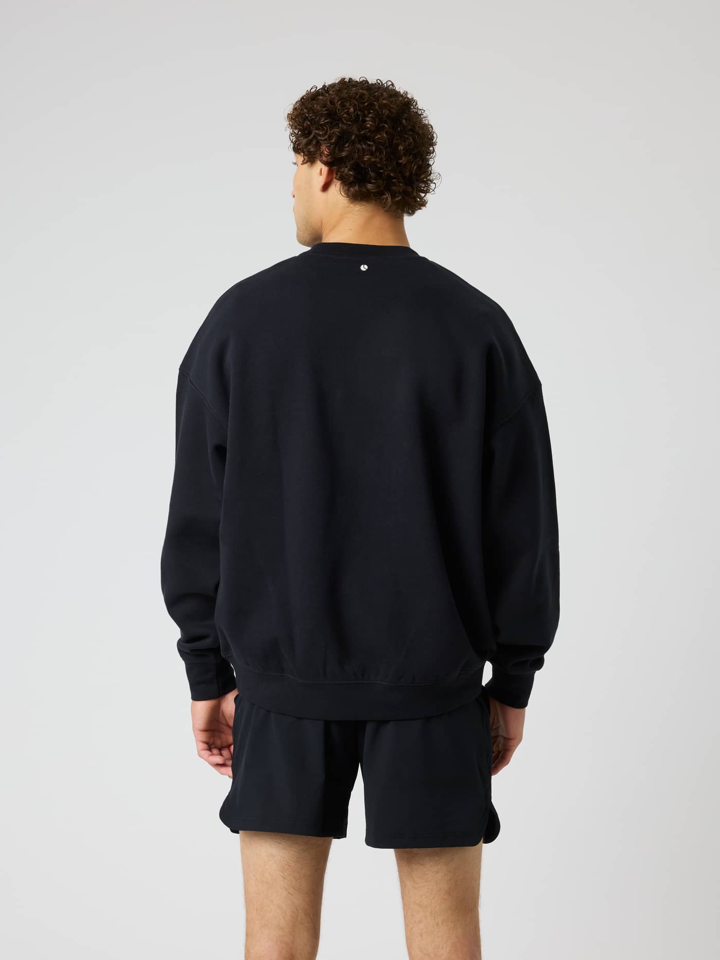 Back view of the Borg Oversized Sweatshirt in Black Beauty (Black) with an oversized fit for training and tennis. - Image 3