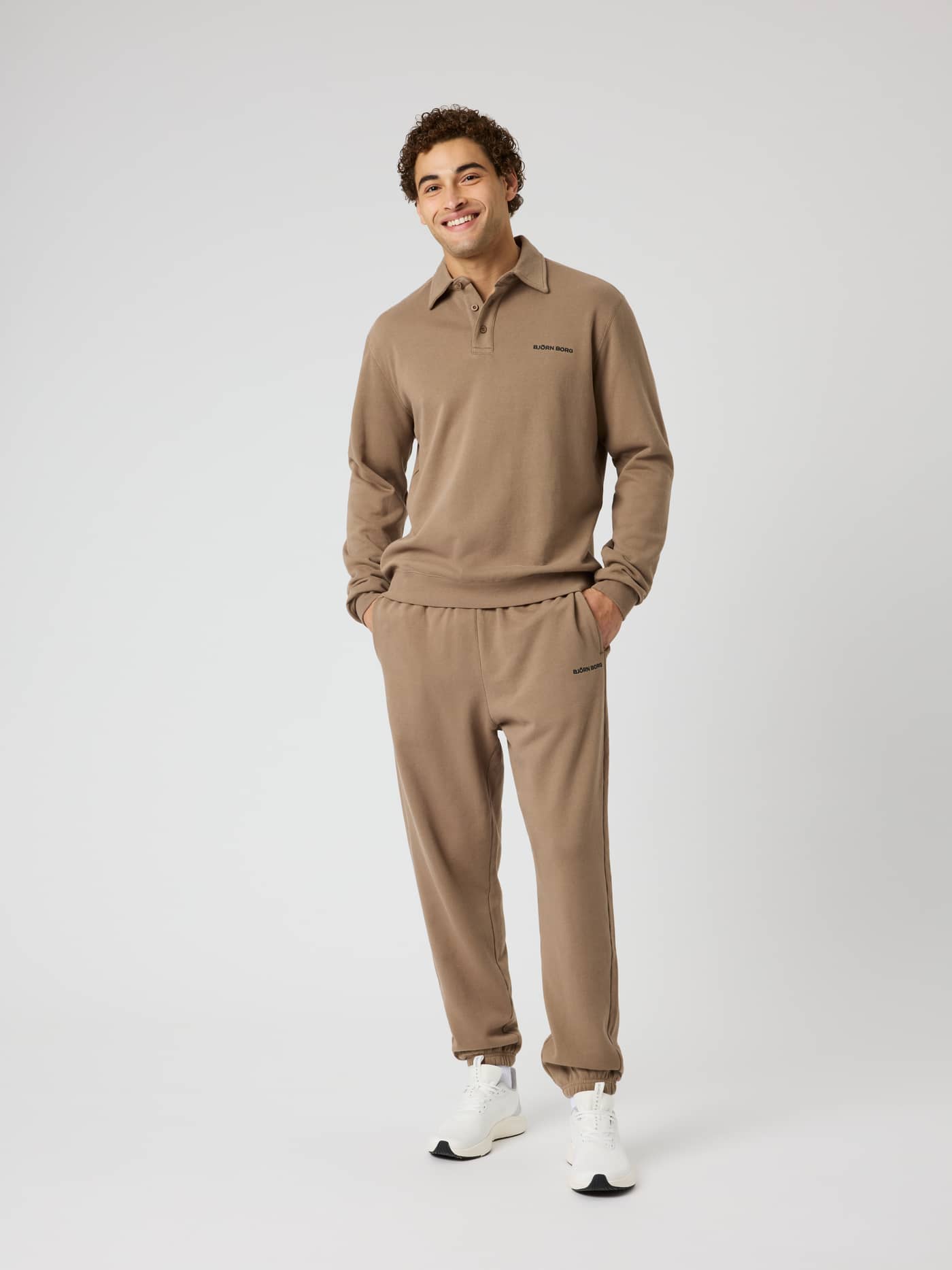 Full-body view of a model wearing the Borg Classic Polo Sweatshirt in Caribou (Brown) with a black logo for training. - Image 3