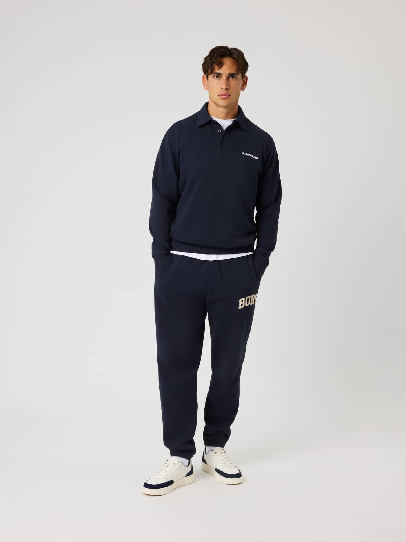 Full-body front view of the cotton Borg Classic Polo Sweatshirt in Night Sky (Navy) with a tennis-inspired style. - Image 3