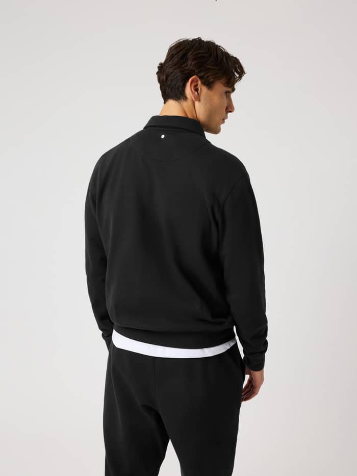 Vue arrière du Borg Classic Polo Sweatshirt en Black Beauty (Noir) avec un détail de balle de tennis pour le training. - Image 2