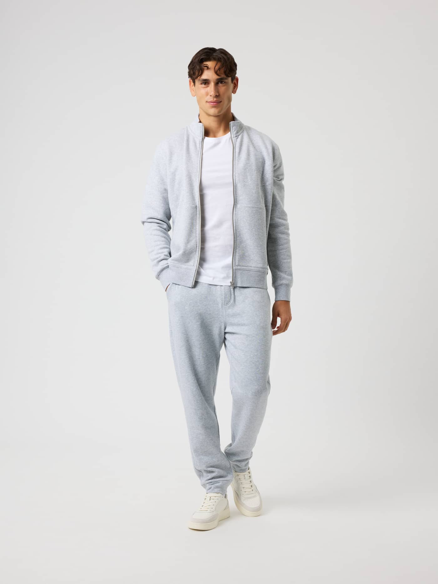 Full-body front view of a model in the Centre Full Zip Sweatshirt in Light Grey Melange (Grey) for a premium leisure look. - Image 3