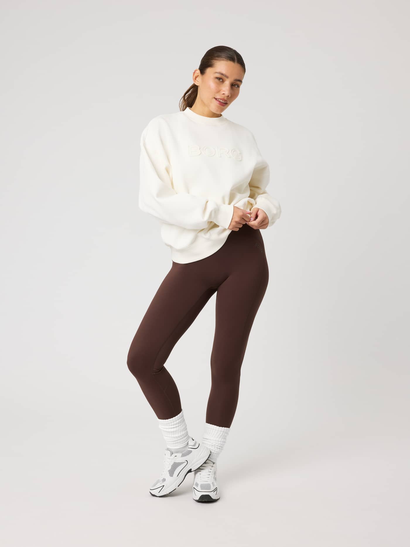 Full-body view of a model wearing the Studio Oversized Sweatshirt in Tofu (White) with tonal BORG embroidery. - Image 3