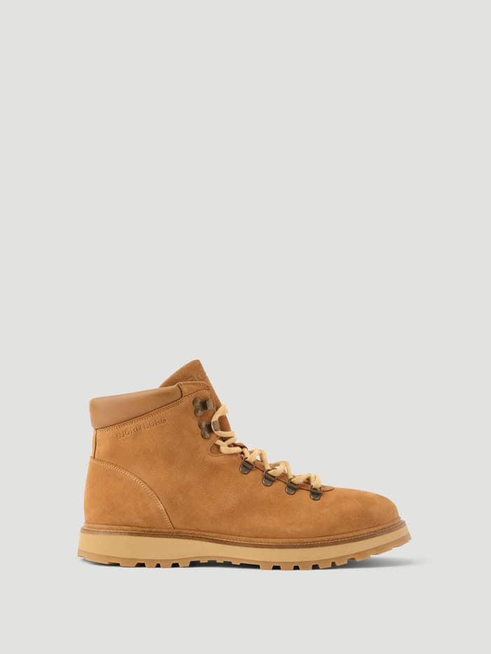 Side view of the Men's Summit Boots in Brown, featuring a premium leather finish, metal eyelets, and a tonal debossed logo.