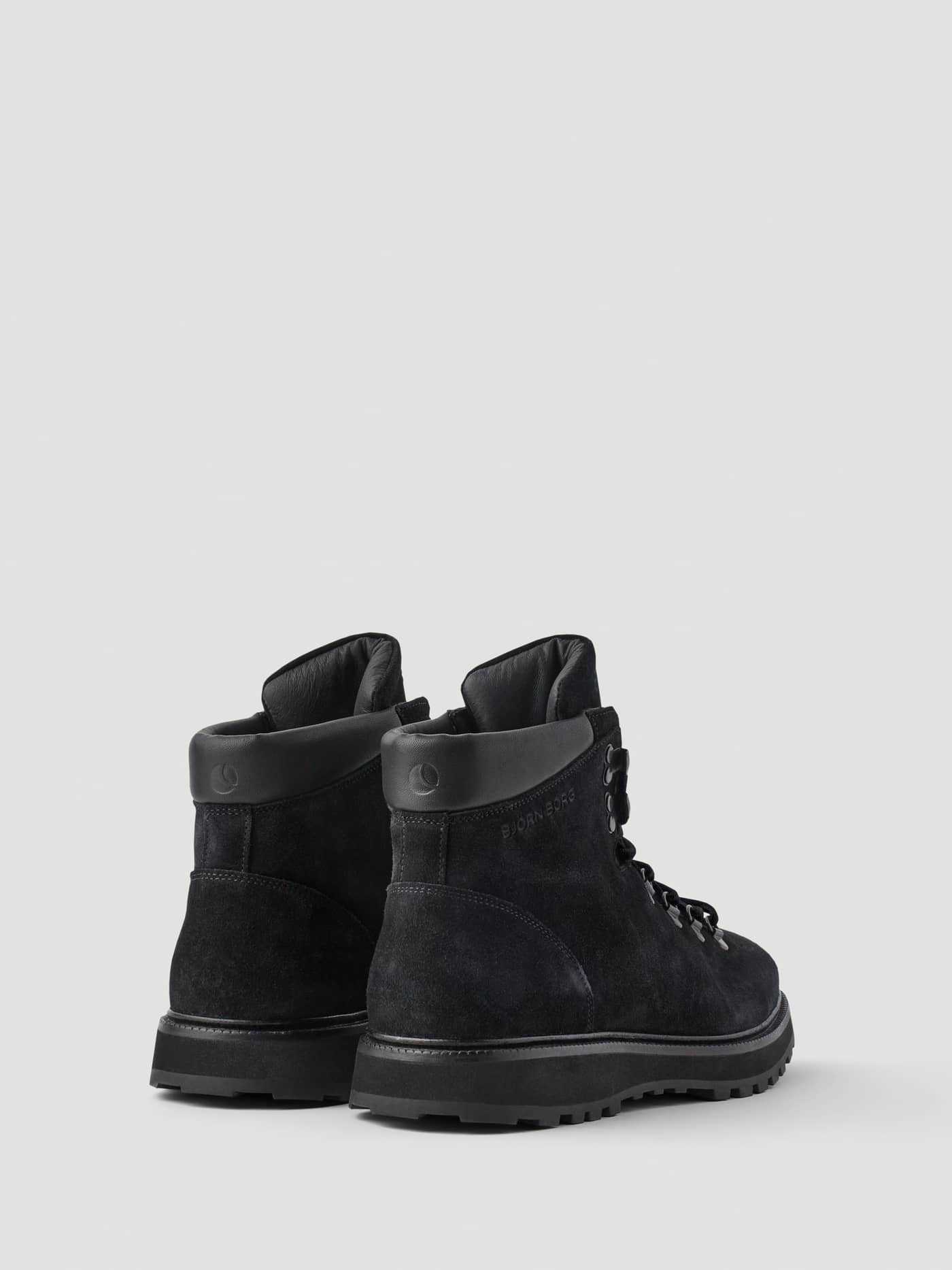Back view of Men's Summit Boots in Black, featuring a genuine leather upper, rugged outsole, and embossed logo detail. - Image 3
