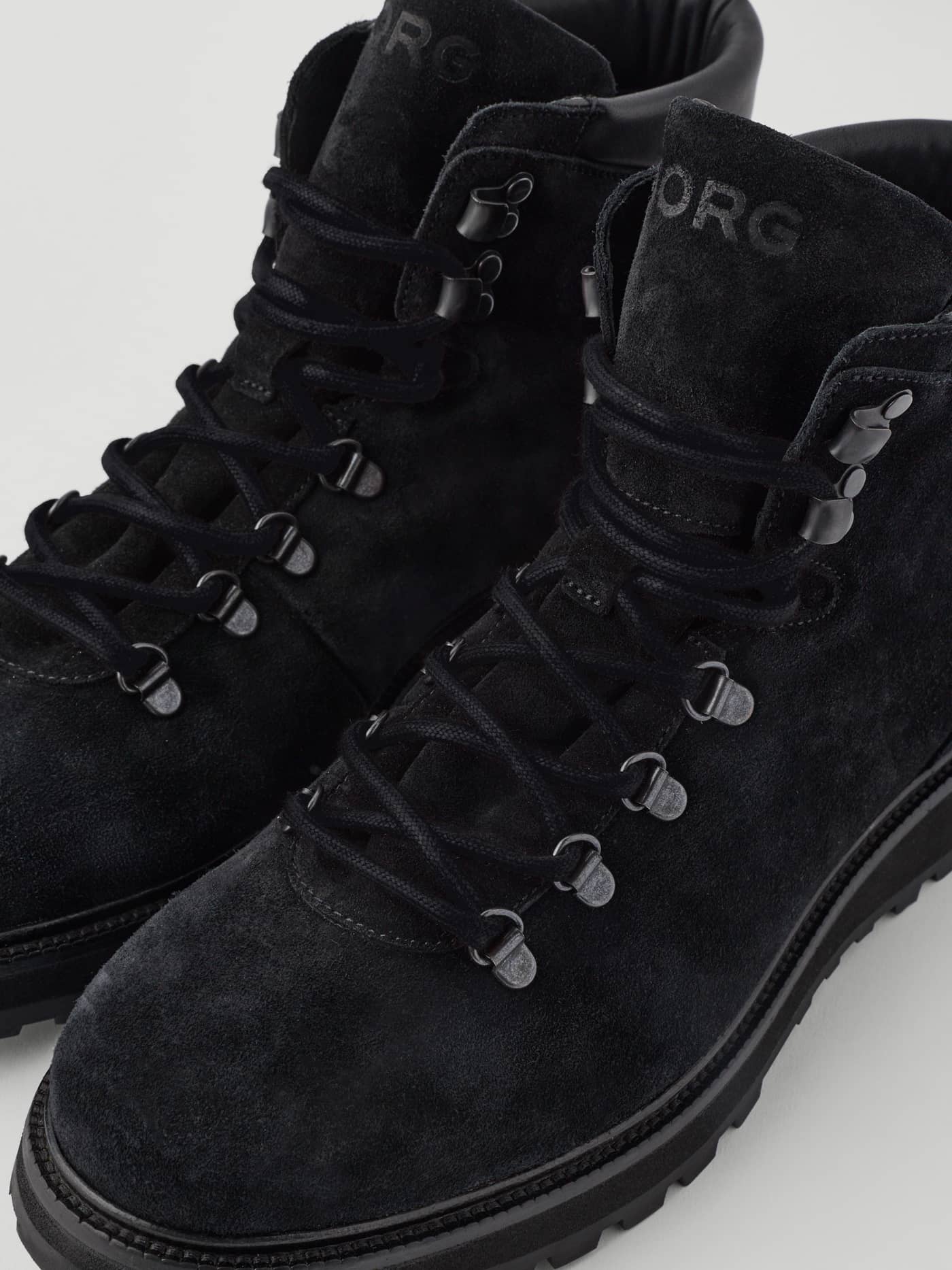 Black Men's Summit Boots in a close-up, featuring premium leather, black hiking eyelets, and a tonal embossed BORG logo. - Image 4