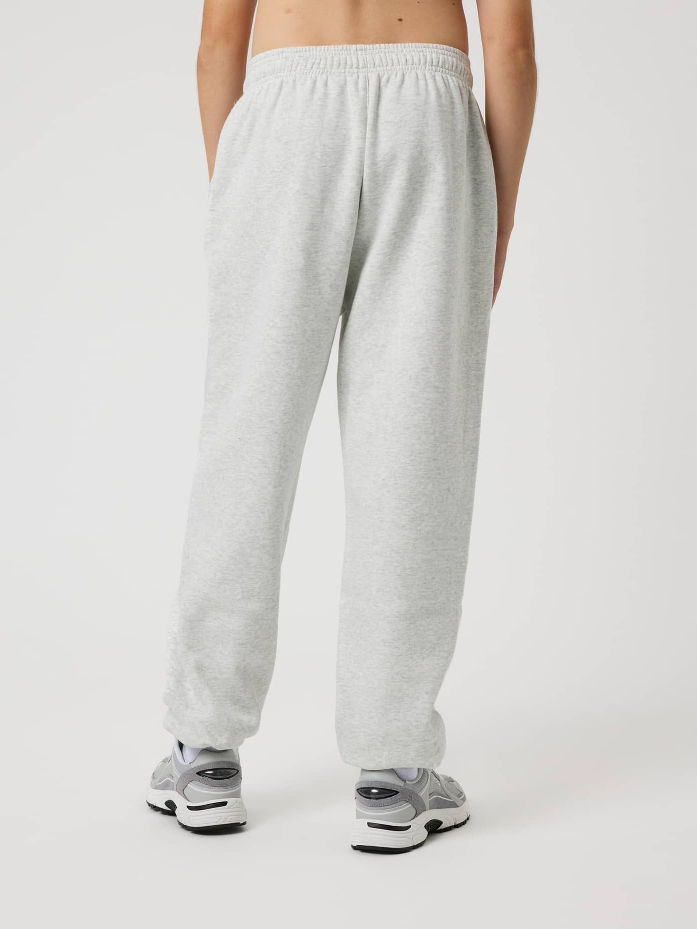 Borg Oversized Sweatpants for kids in Ultra Light Grey Melange (Grey) shown from a back view for a relaxed tennis style. - Image 2