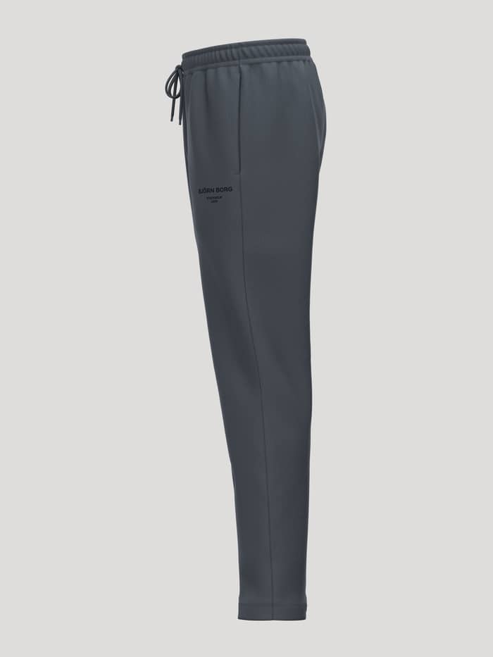 Side view of the Borg Essential 1 Sweatpants in Turbulance (Grey) featuring an adjustable drawstring and a black logo.