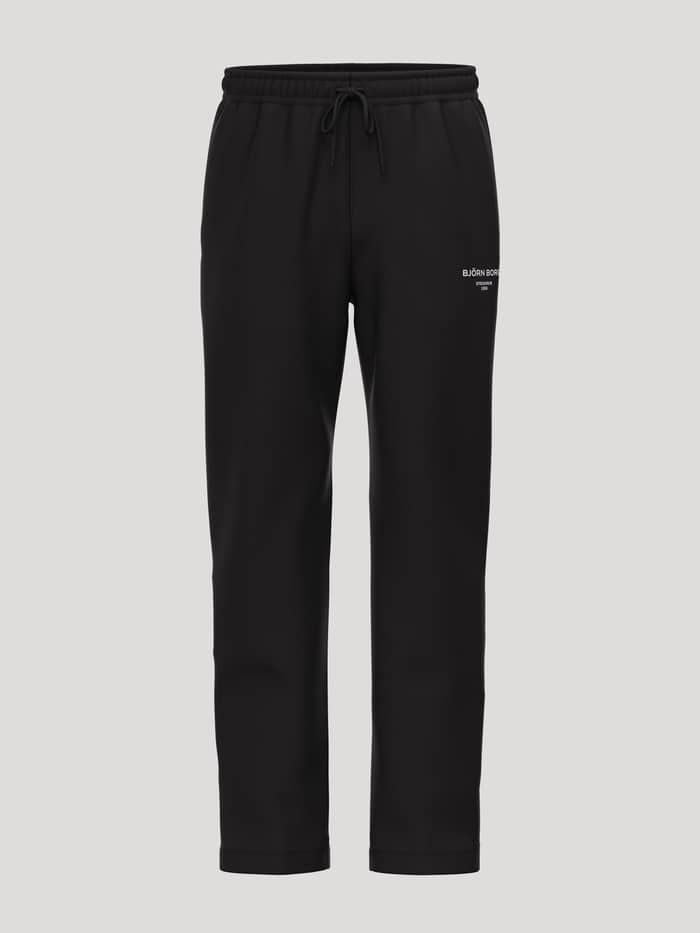 Borg Essential 1 Sweatpants in Black Beauty (Black) featuring a white logo, drawstring waist and soft fleece for tennis.