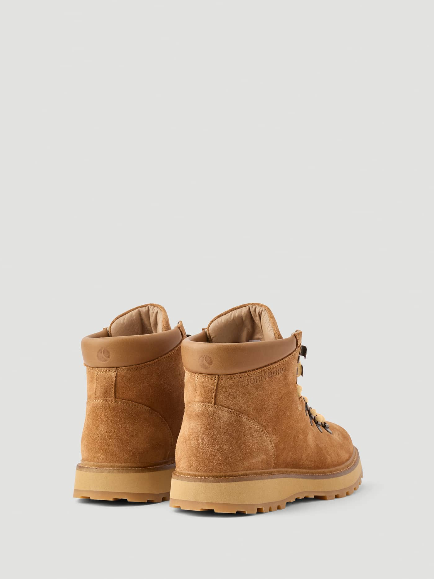 Women's Summit Boots in Brown, featuring a premium suede leather upper, tonal heel logo, and a durable rubber sole. - Image 3