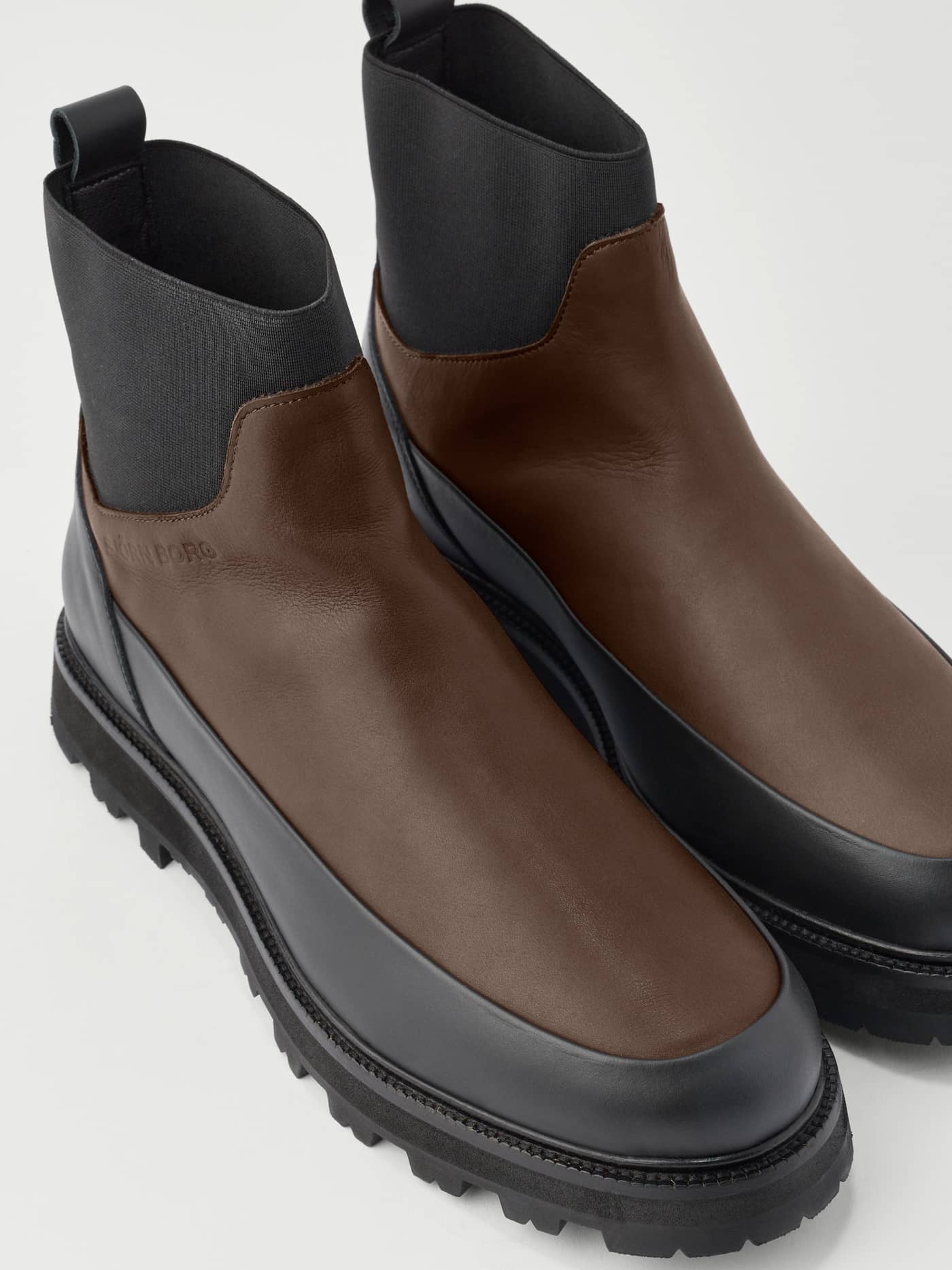 Men's Summit Chelsea Vibram Boots in Brown and Black leather with a debossed logo and durable Vibram lug sole. - Image 4