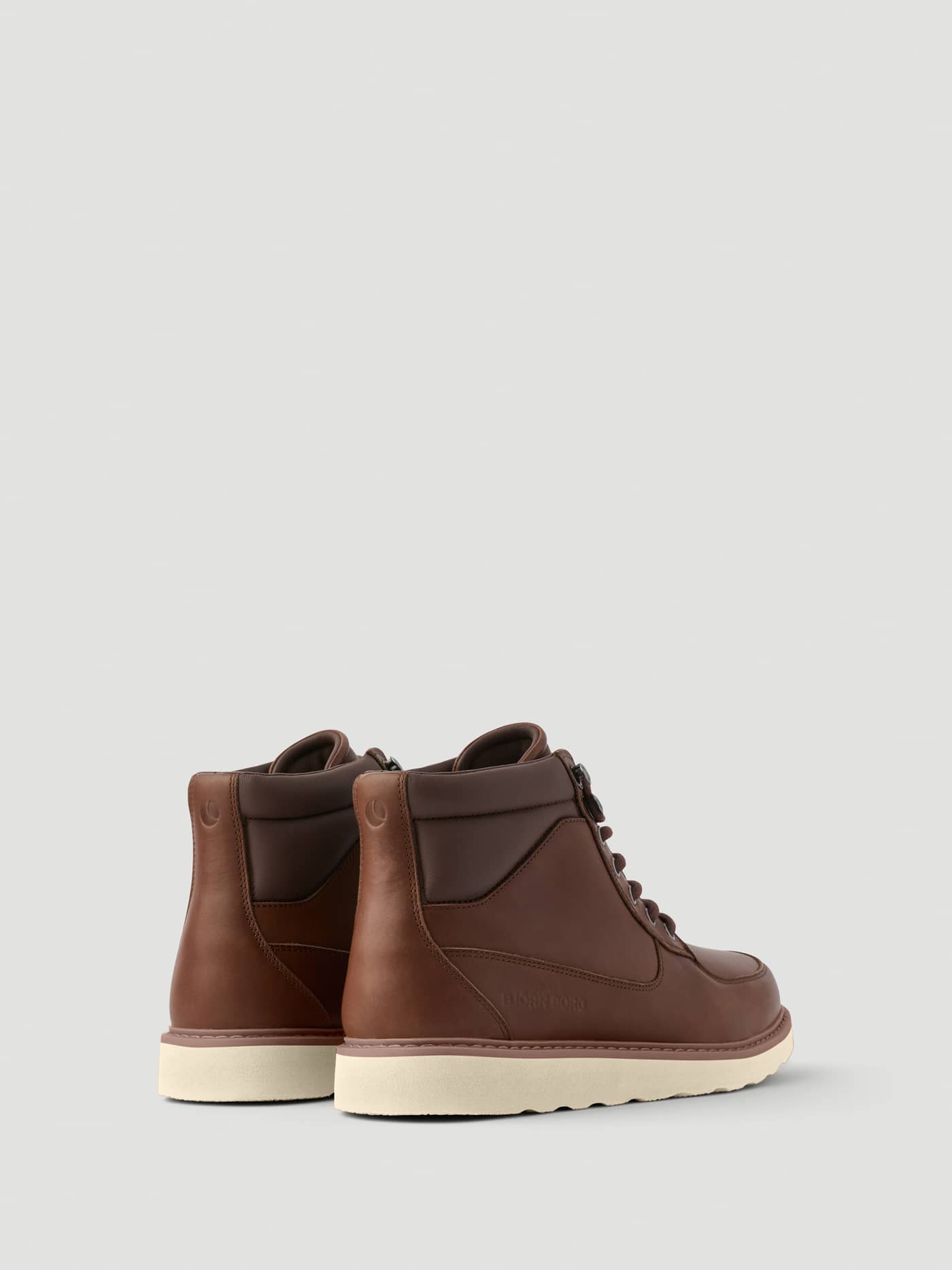 Back view of Men's Altitude Boots in Brown leather featuring a sturdy off-white sole and padded collar. - Image 3