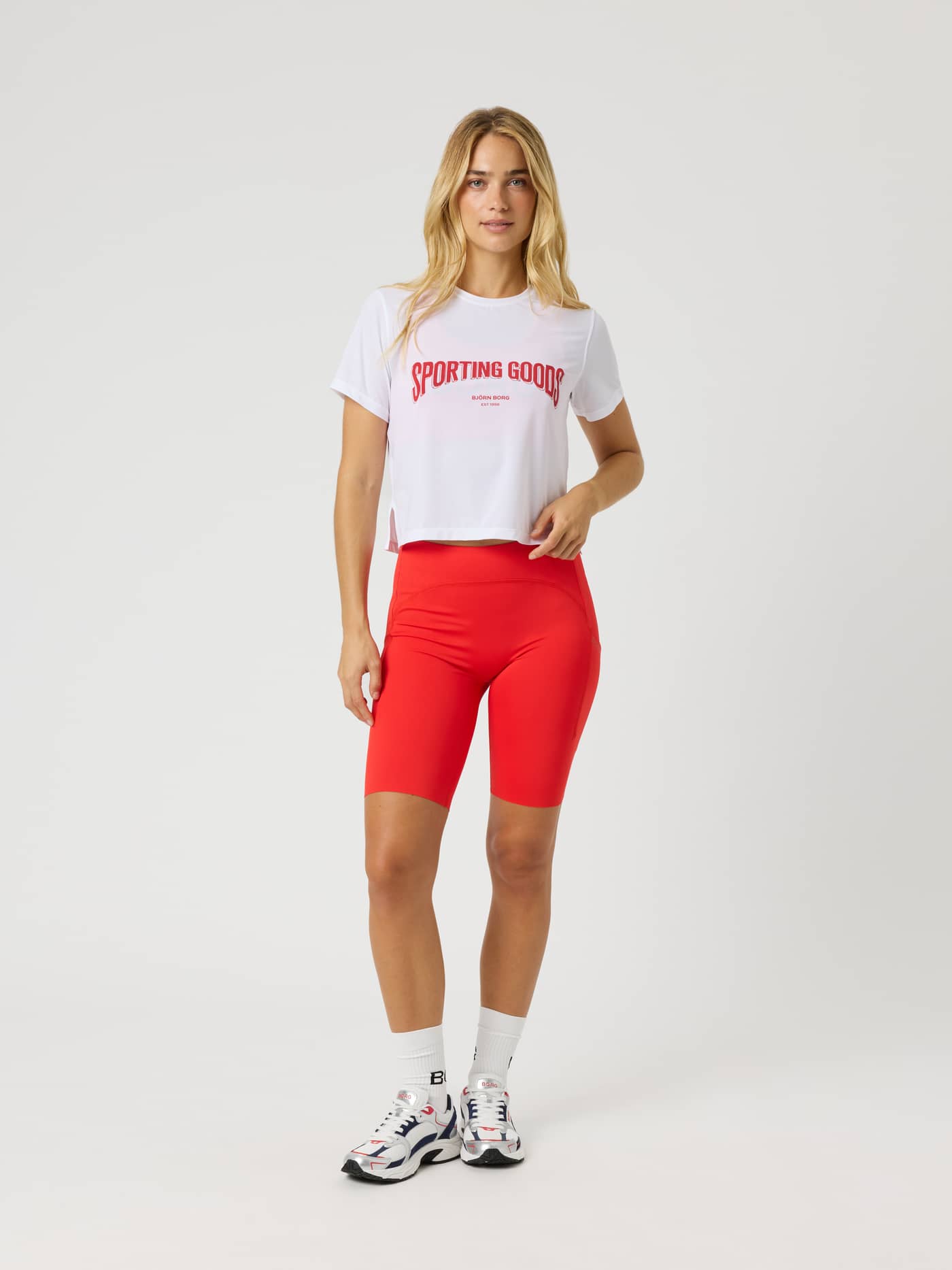 Full-body front view of the Borg Cropped T-Shirt in Brilliant White (White) for training and tennis with a red logo. - Image 4