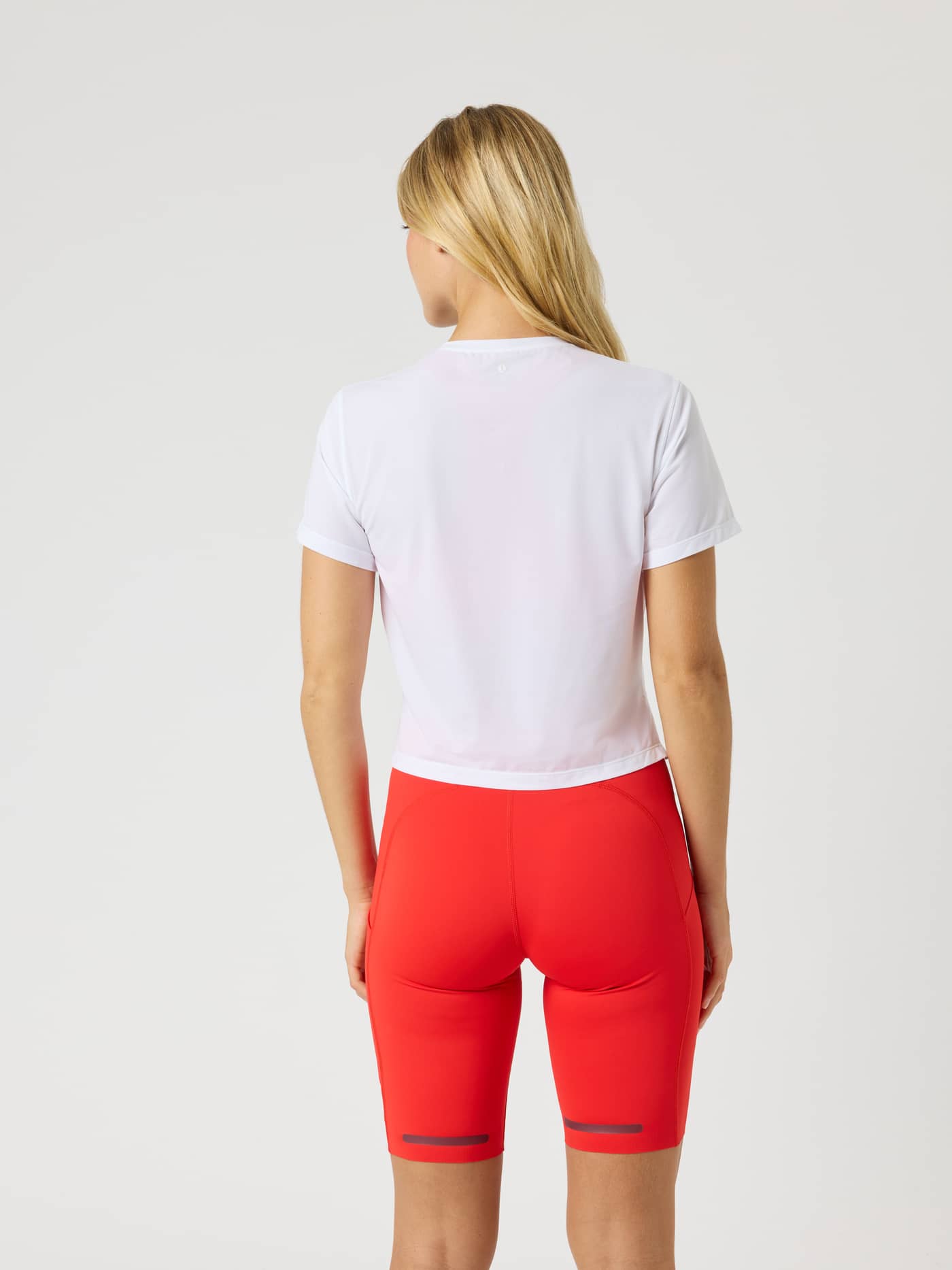 Back view of the Borg Cropped T-Shirt in Brilliant White (White), featuring a modern cropped fit for technical training. - Image 3