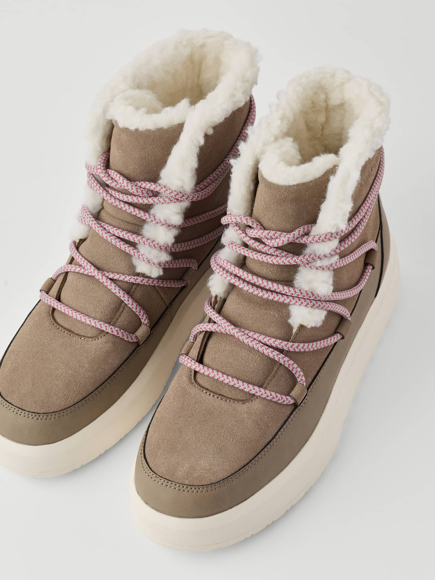 Women's Wooly Lace Up Boots in Brown with a warm white wool lining, pink speckled laces, and a tonal logo. - Image 4